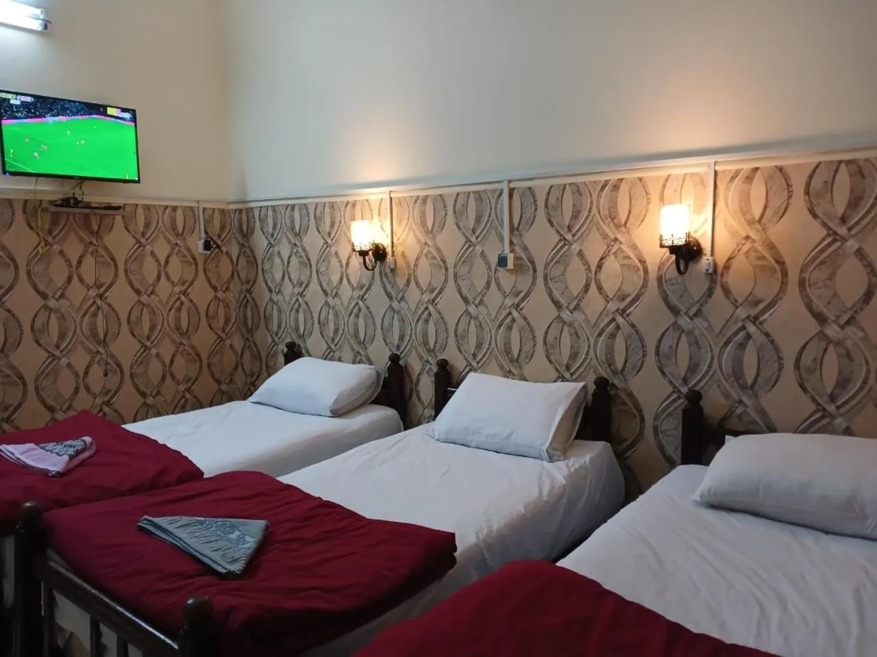 Bed in New Palace Hotel