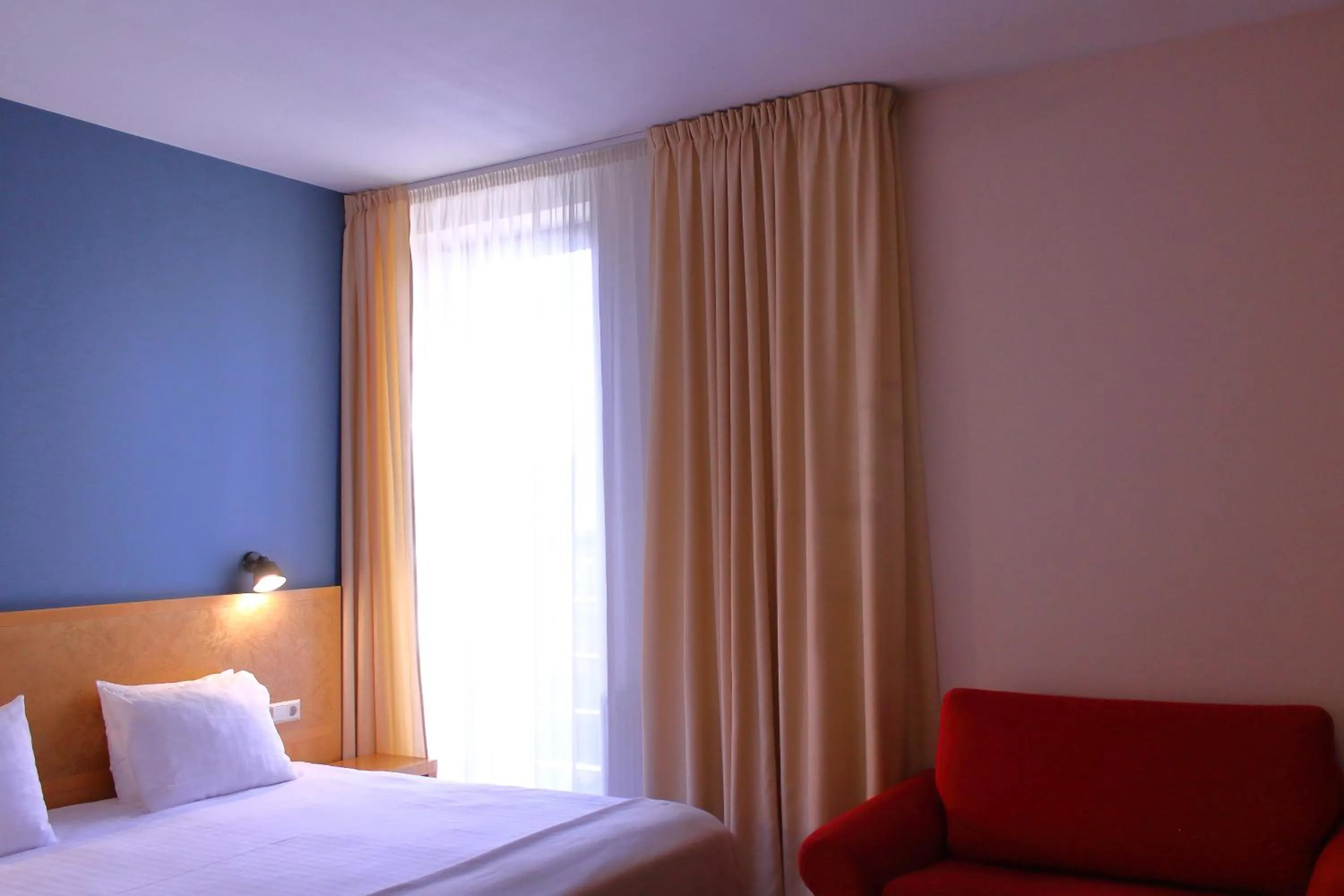 Bed in Hotel Kolumbs