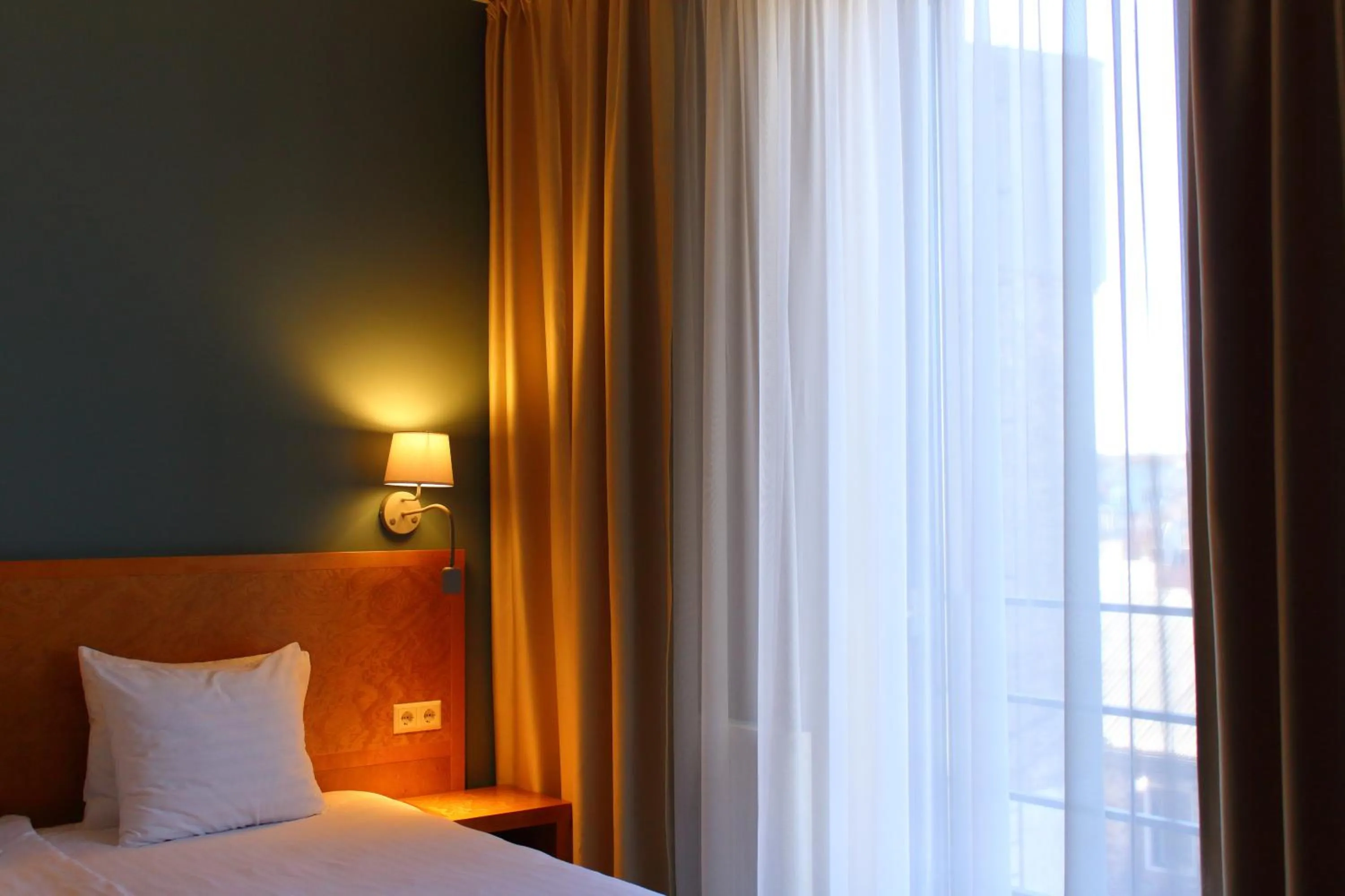 Bed in Hotel Kolumbs