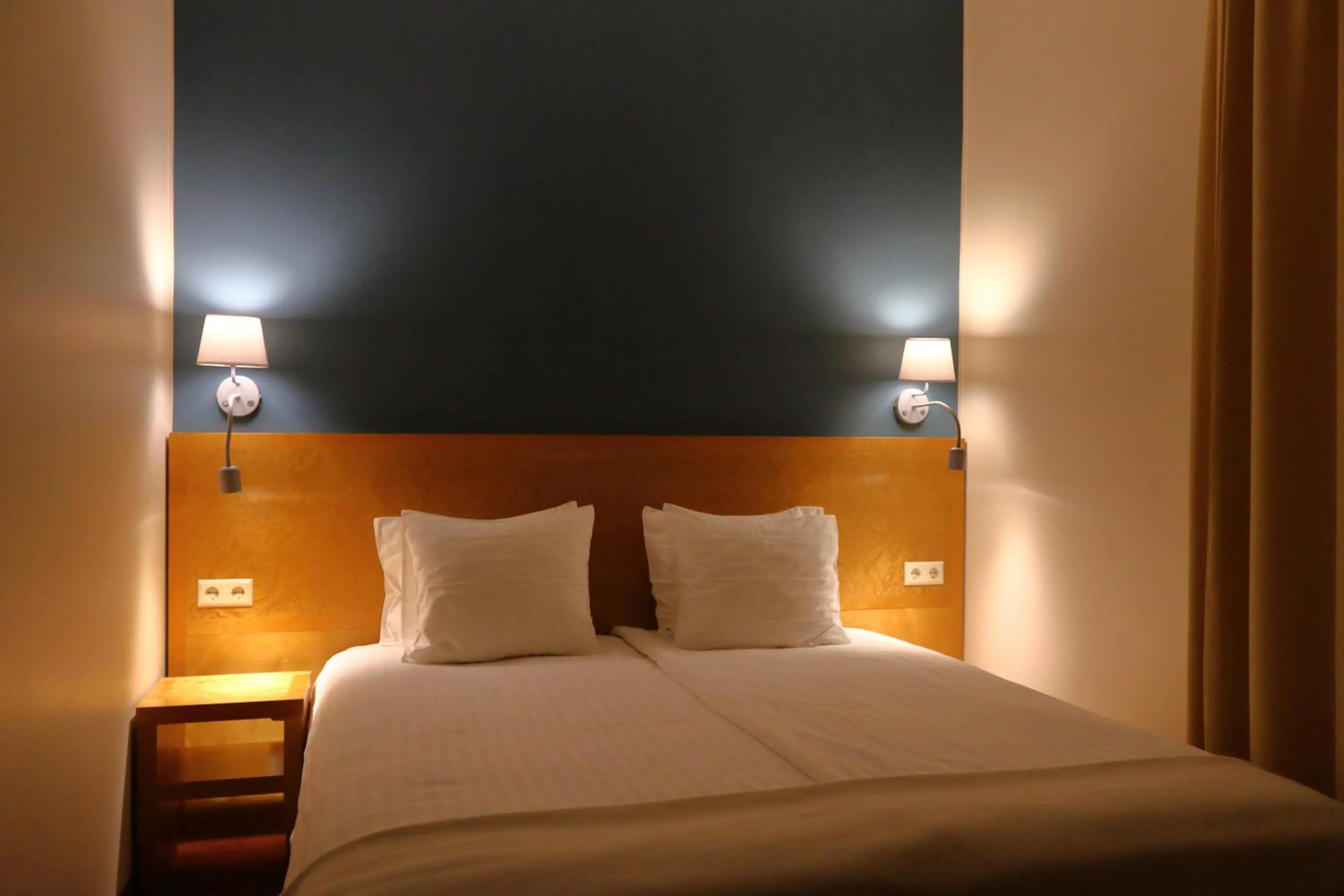 Bed in Hotel Kolumbs