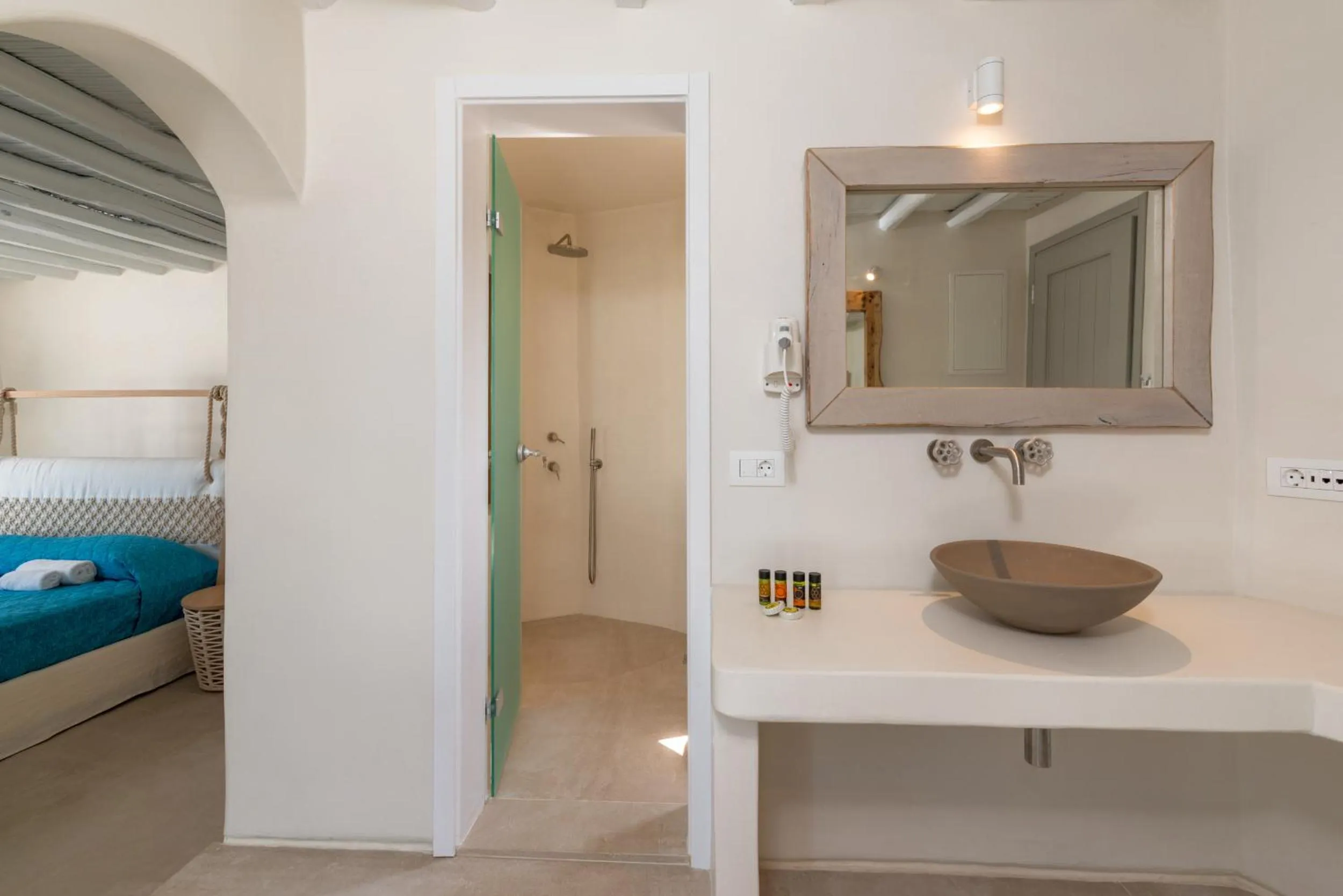 Bathroom, Bed in Legacy Suites