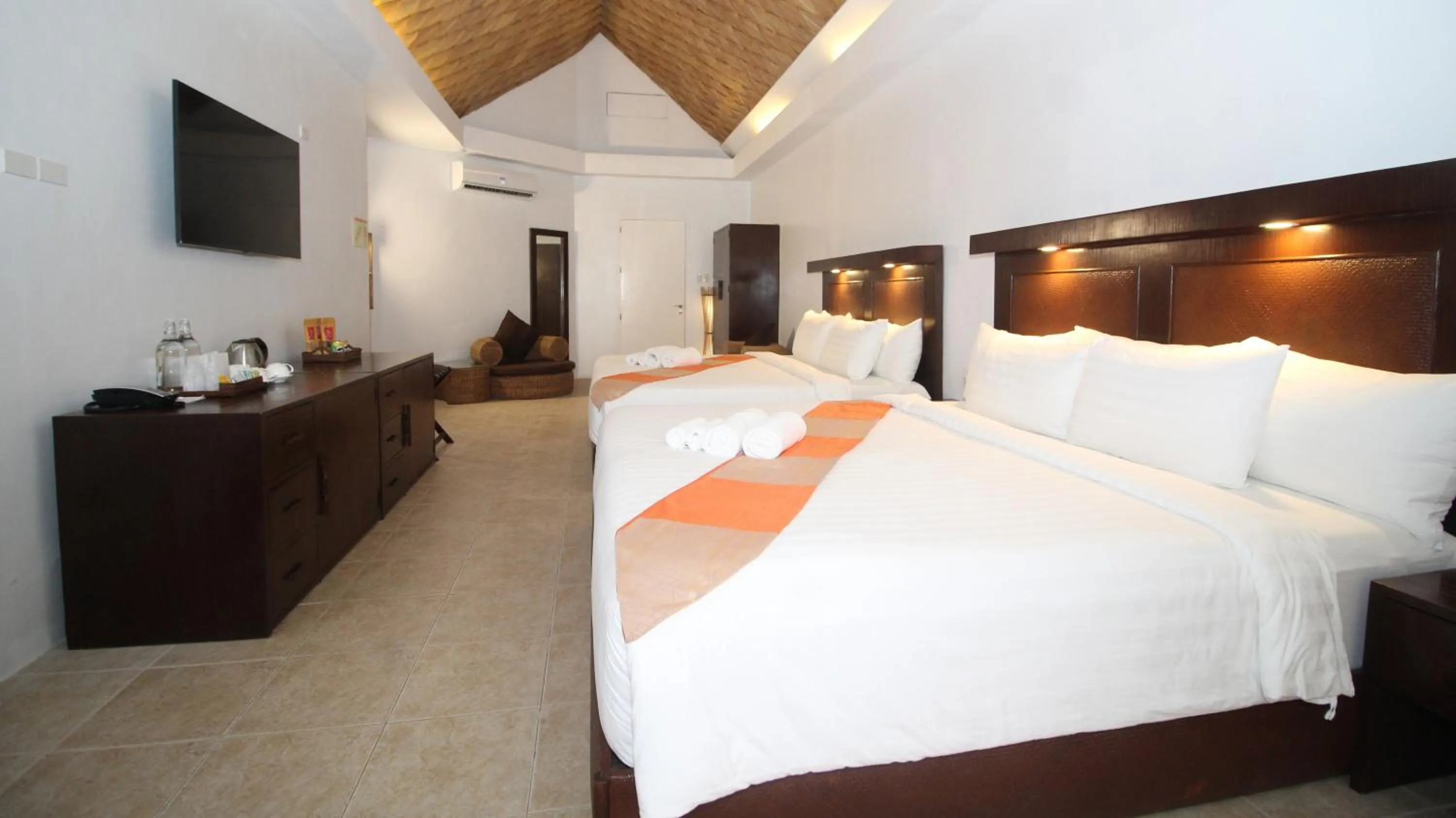 Bed in Ambassador In Paradise