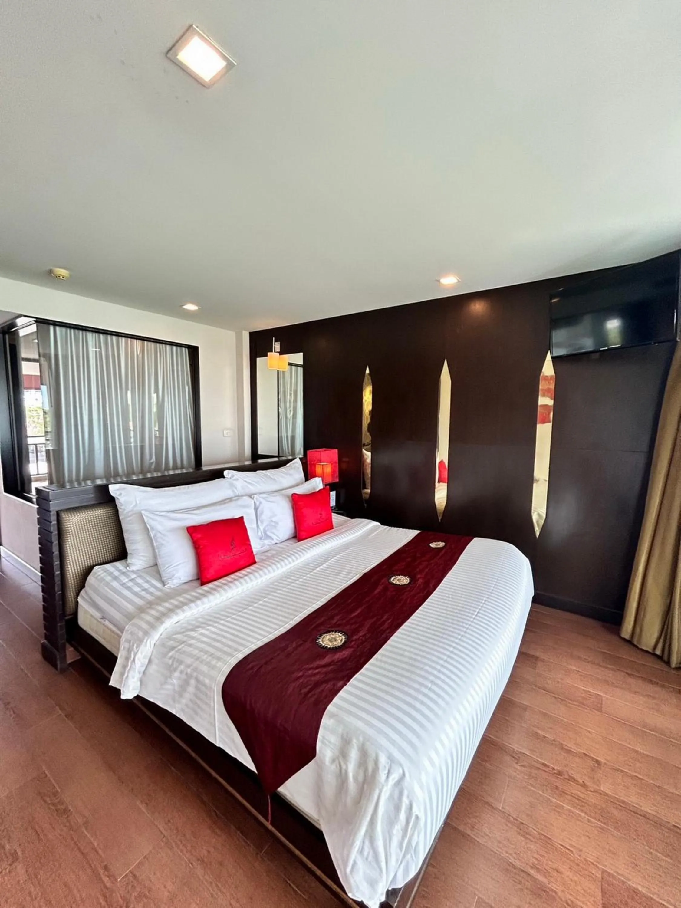 Bed in Royal Thai Pavilion Jomtien Hotel