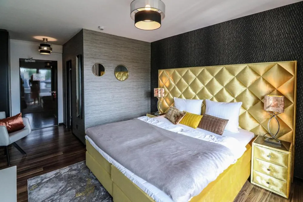 Bed in Kurhaus Design Boutique Hotel