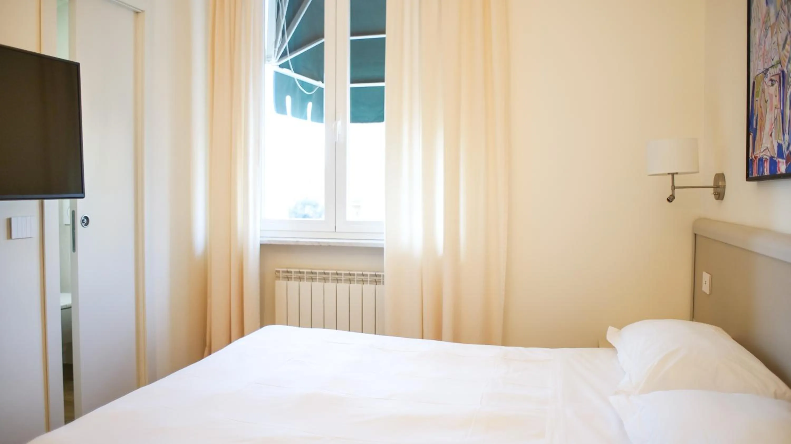 Photo of the whole room, Bed in Rex Hotel Residence