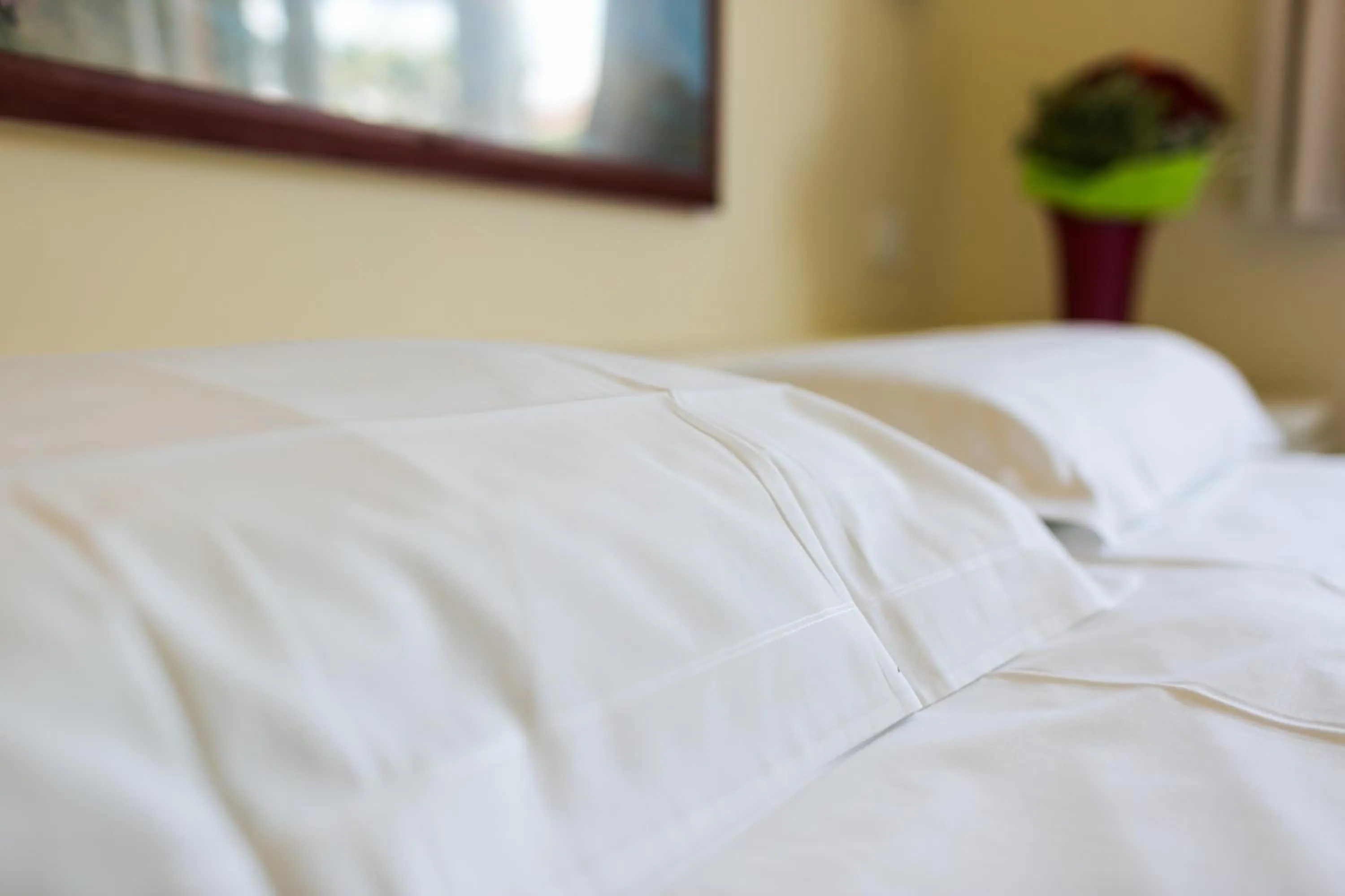 Bed in Rex Hotel Residence