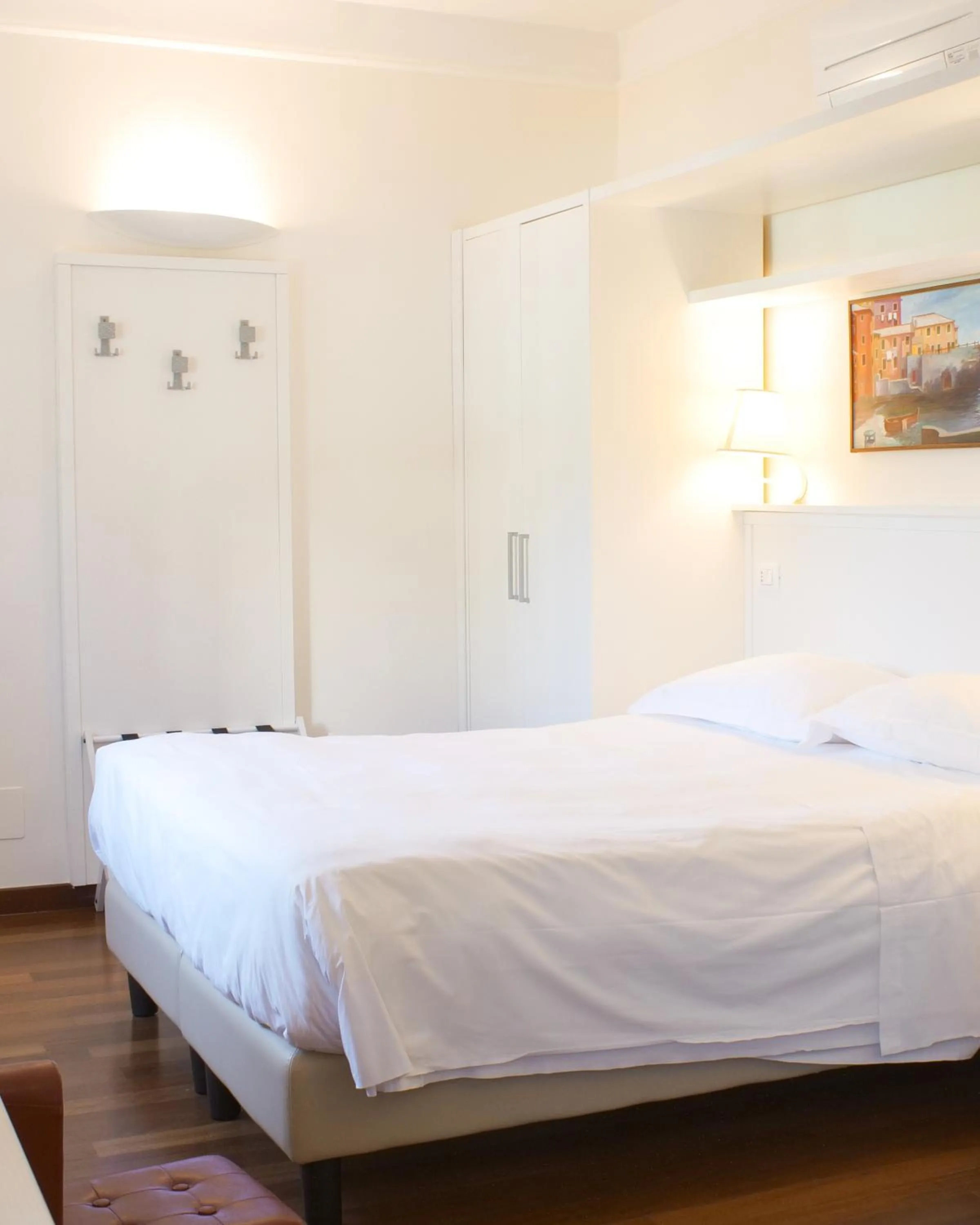 Bed in Rex Hotel Residence