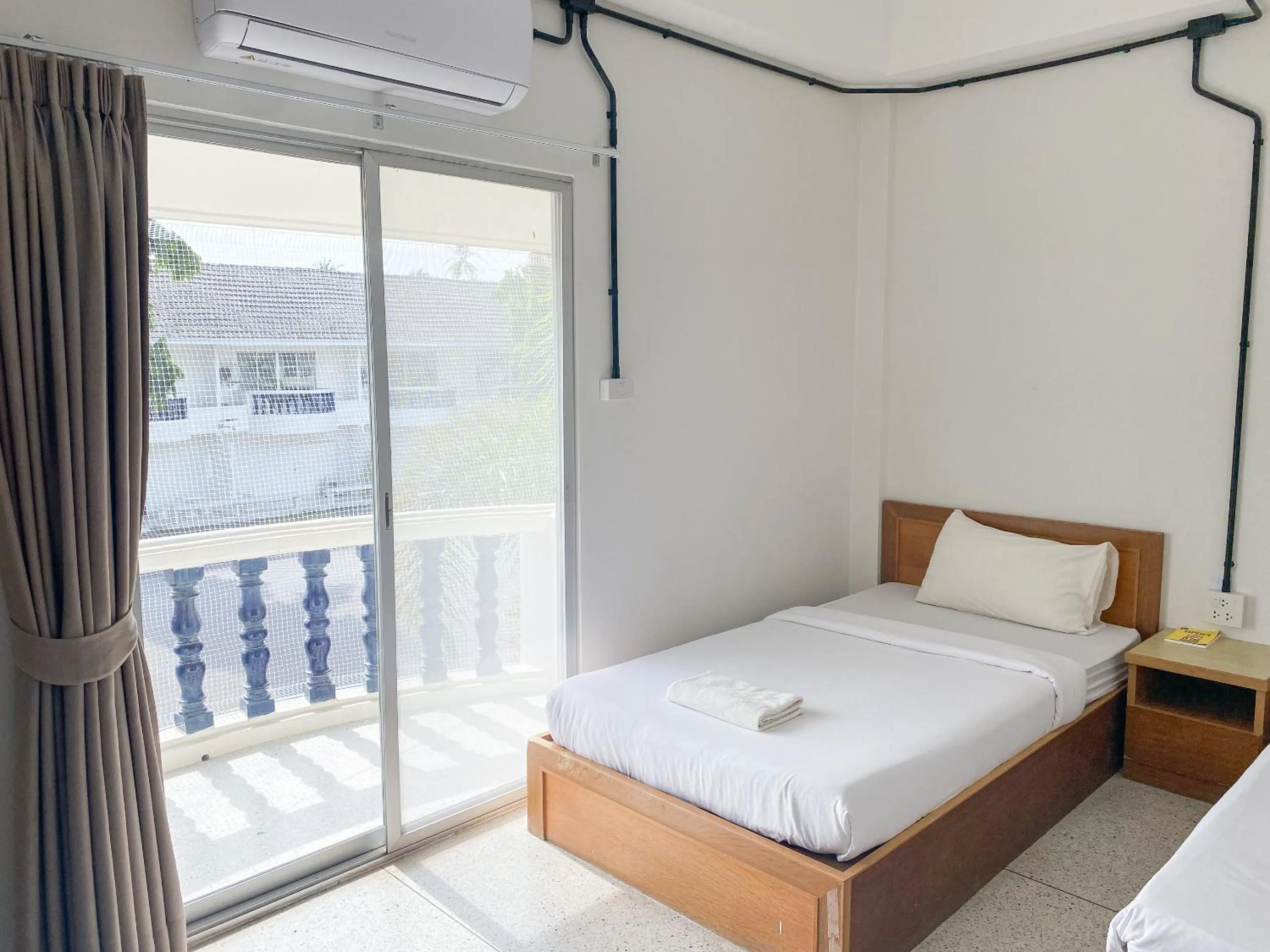 View (from property/room), Bed in Bangsaphan Resort