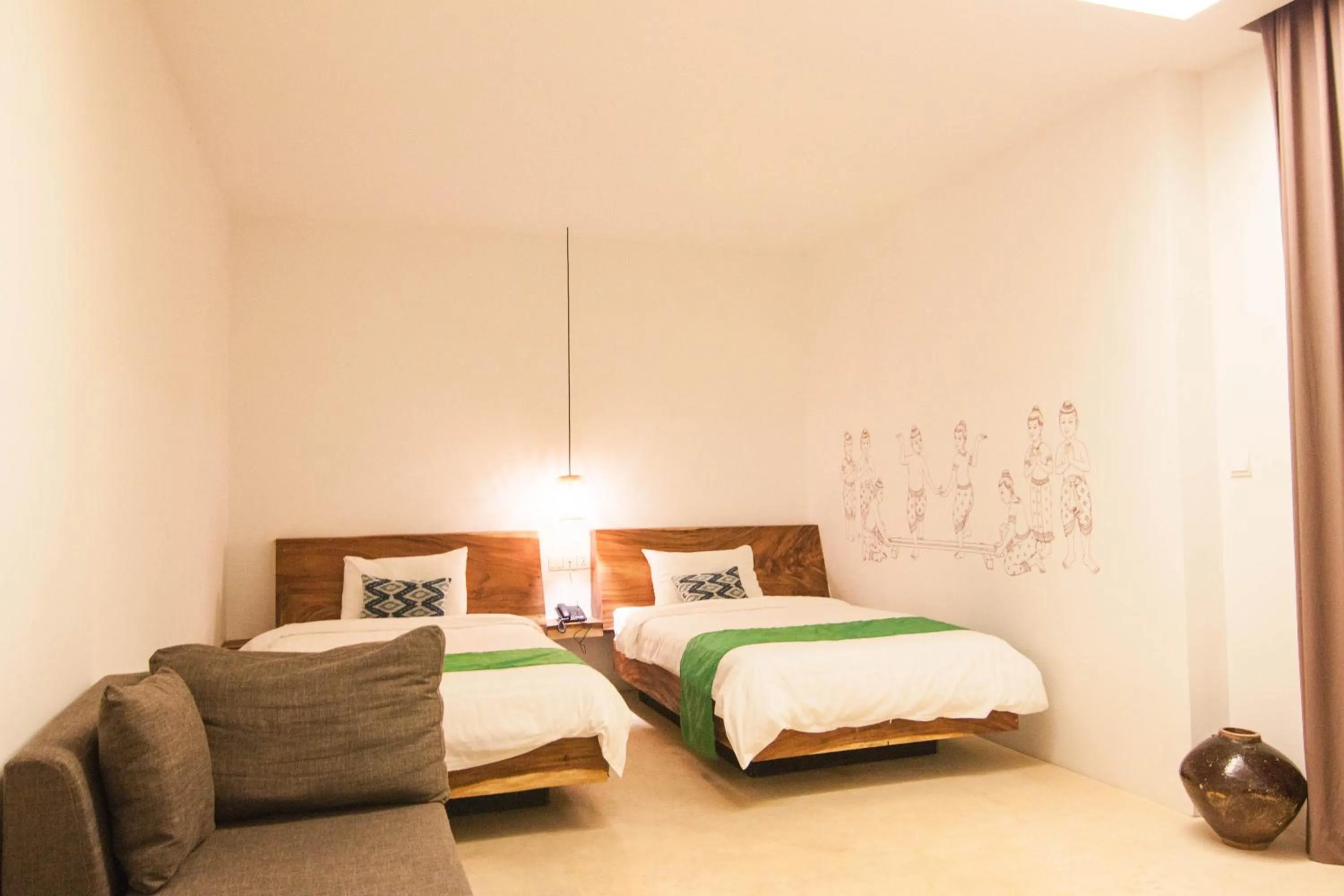 Bed in Sarina Boutique Hotel