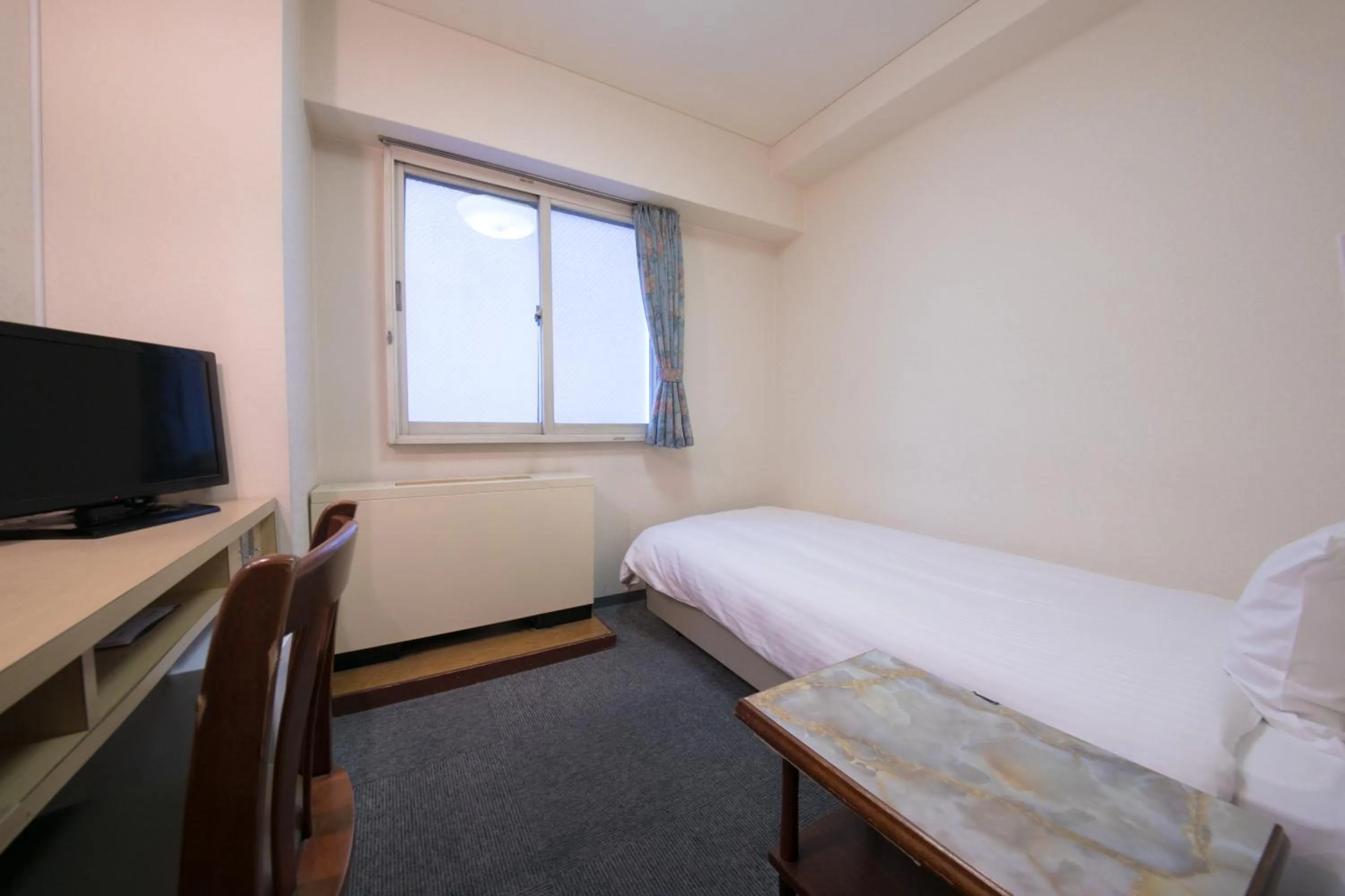 Bed in Heiwadai Hotel Arato