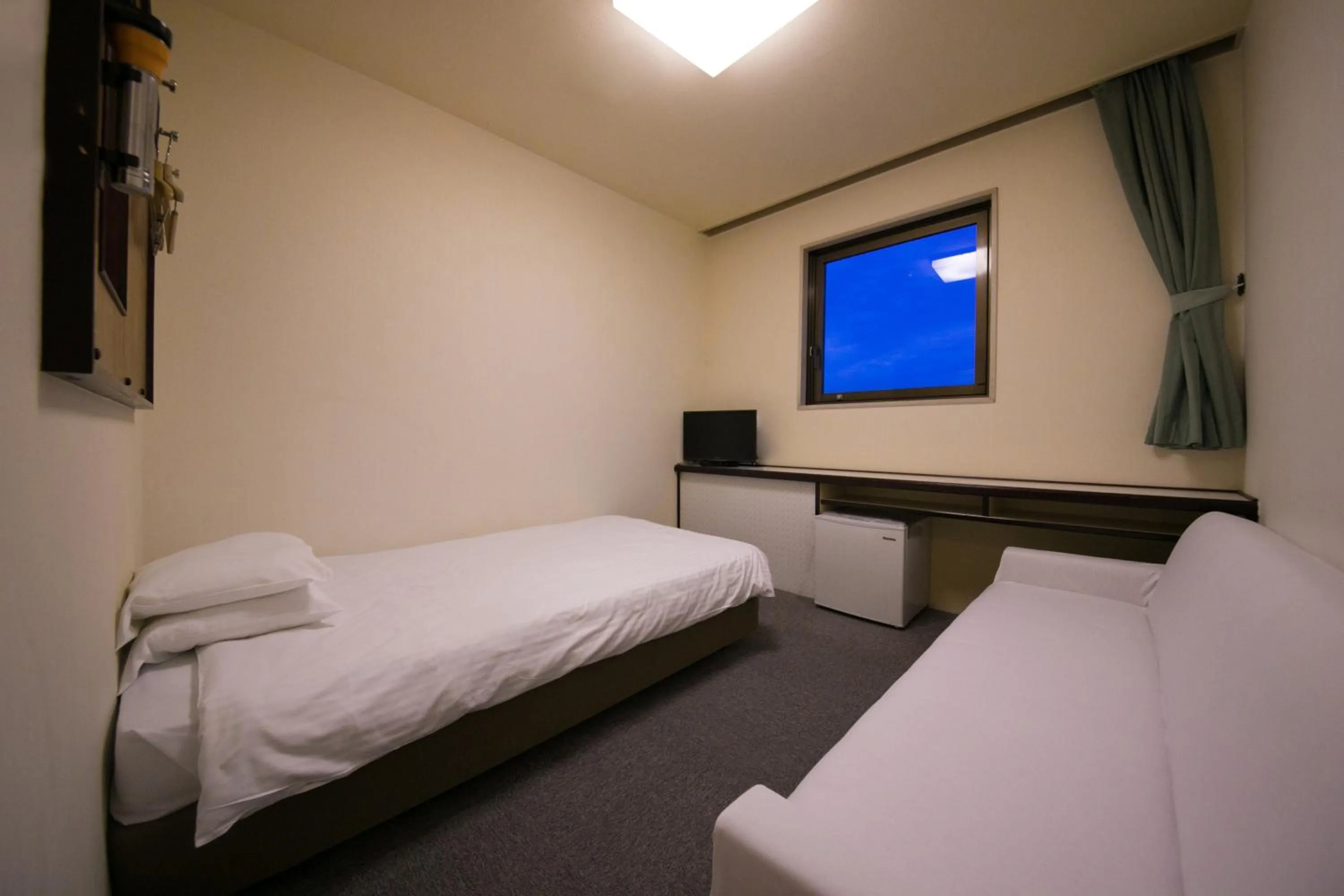 Bed in Heiwadai Hotel Otemon