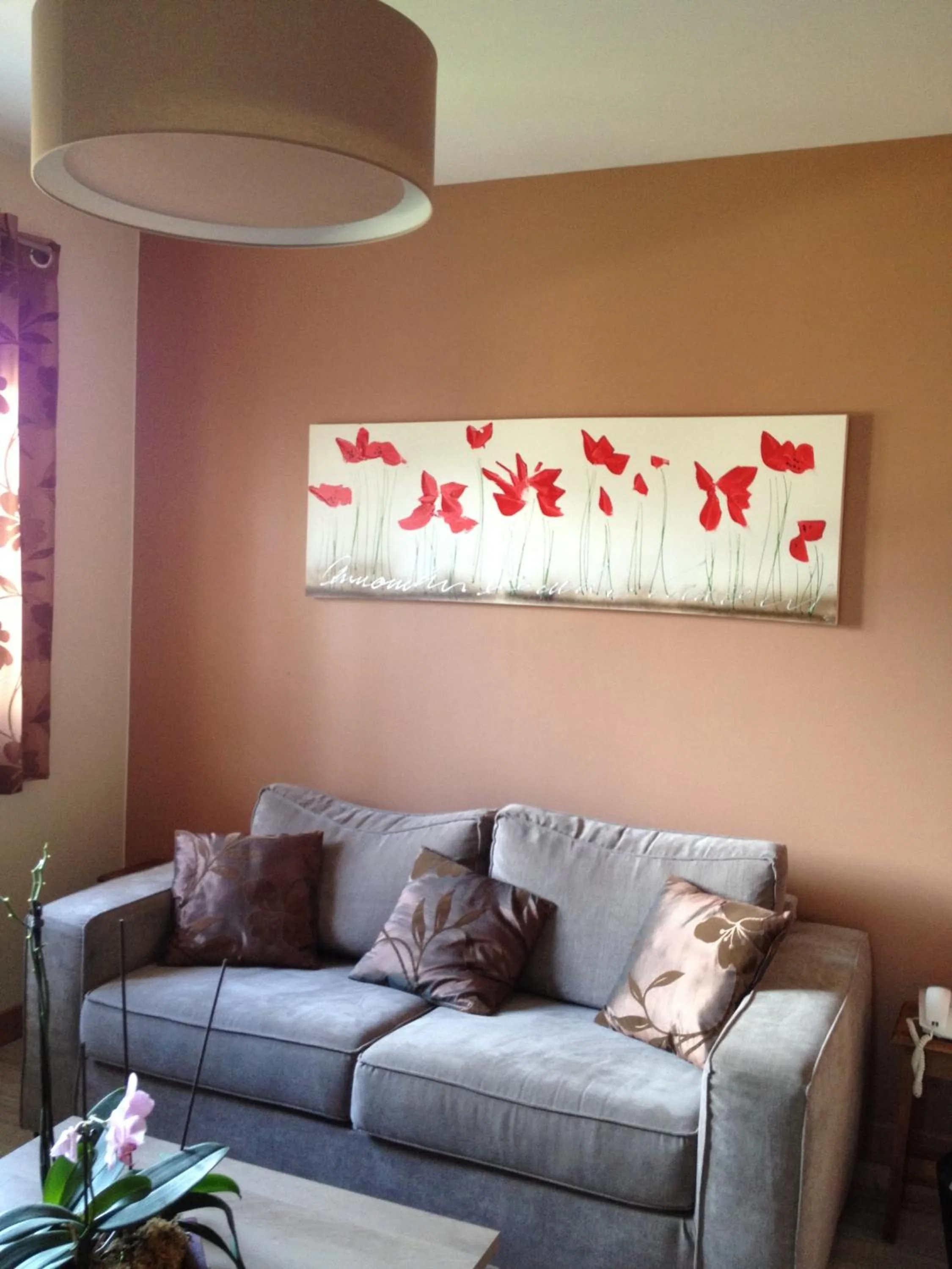 Seating area in Logis Hôtel Restaurant Le Castel Fleuri