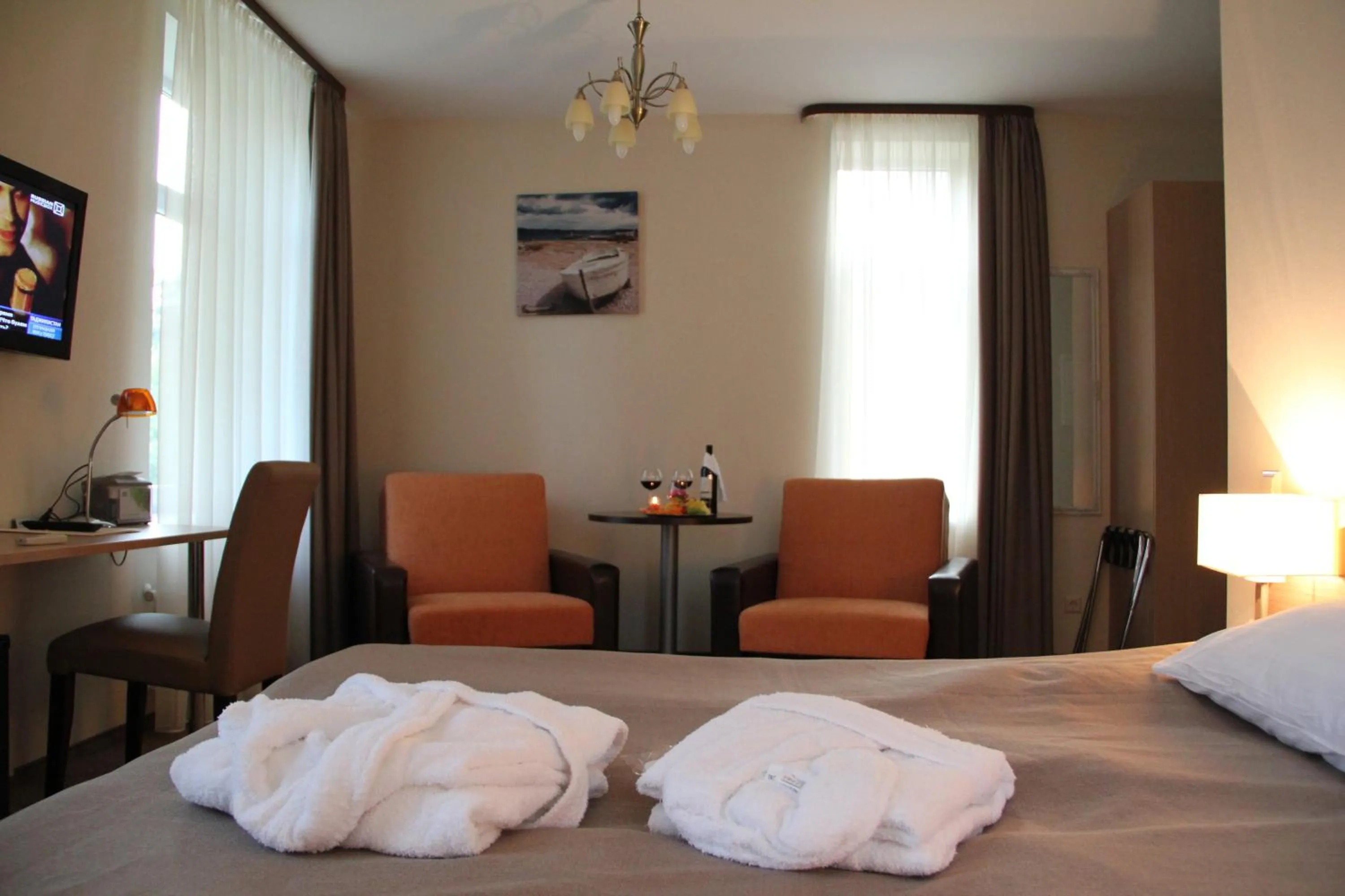 Seating area, Bed in Dzintars Hotel