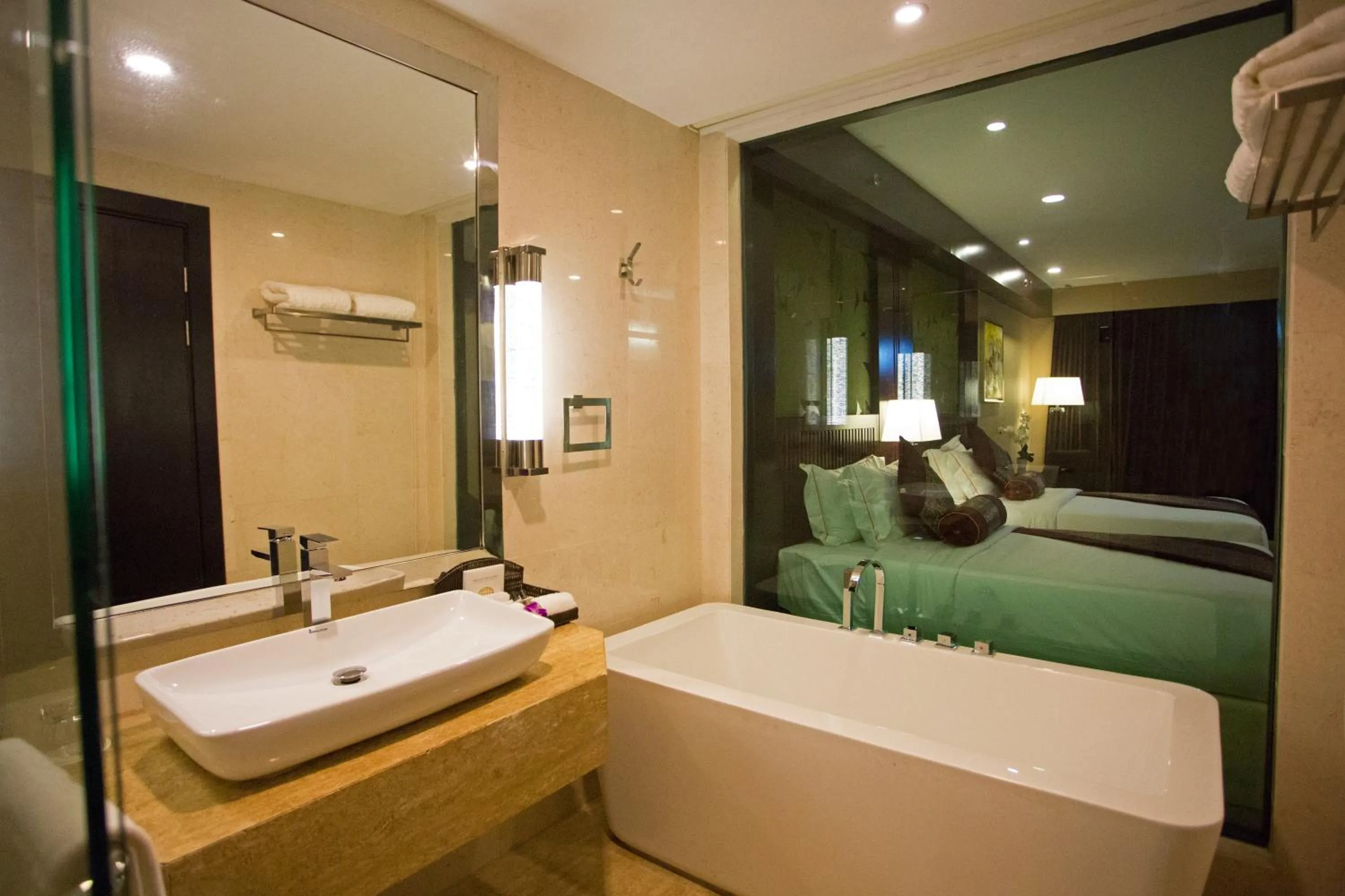 Bed in Royale Signature Hotel