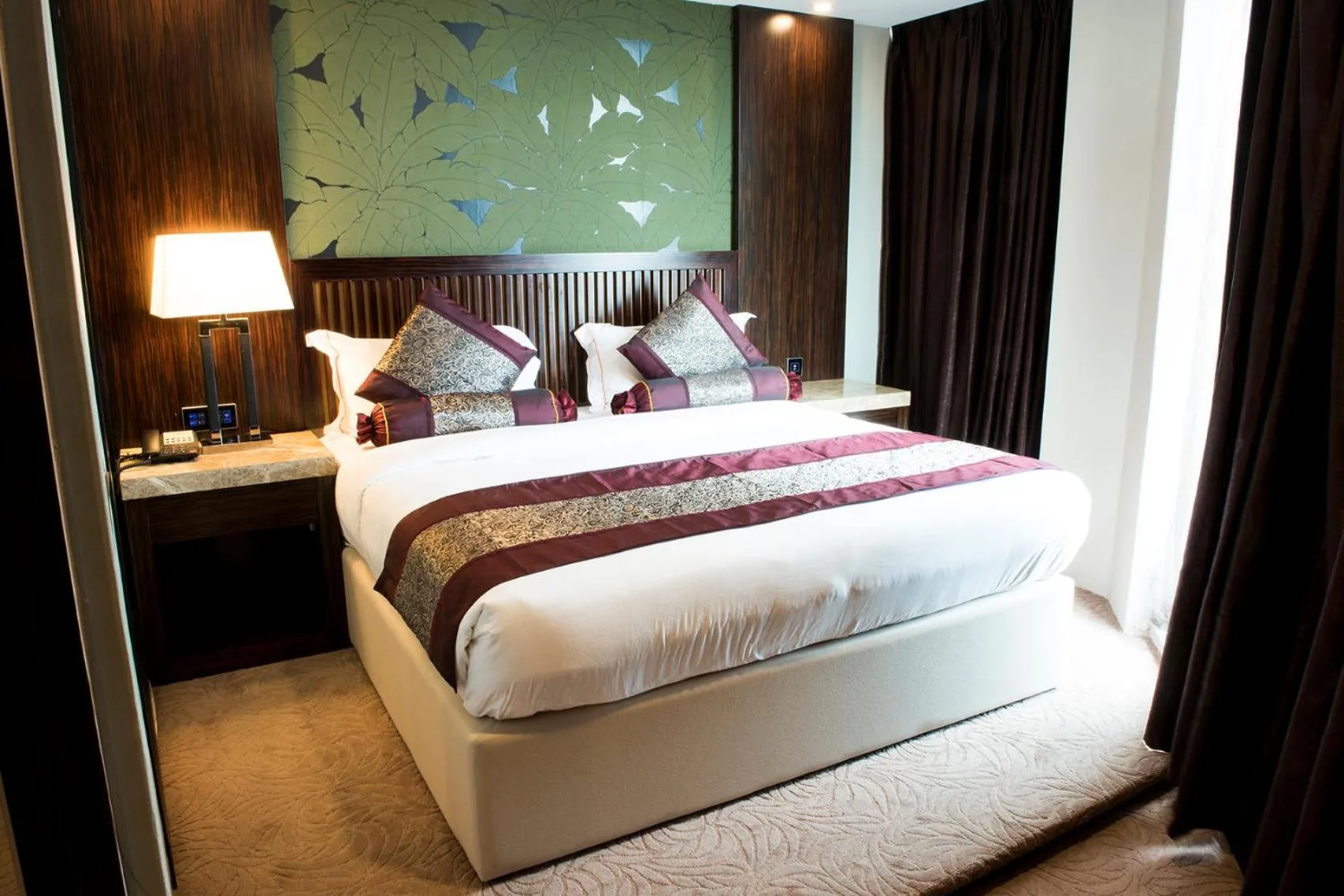 Bed in Royale Signature Hotel