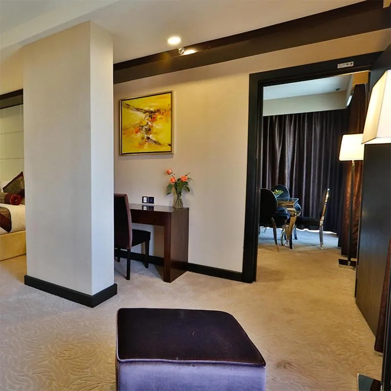 Bed in Royale Signature Hotel