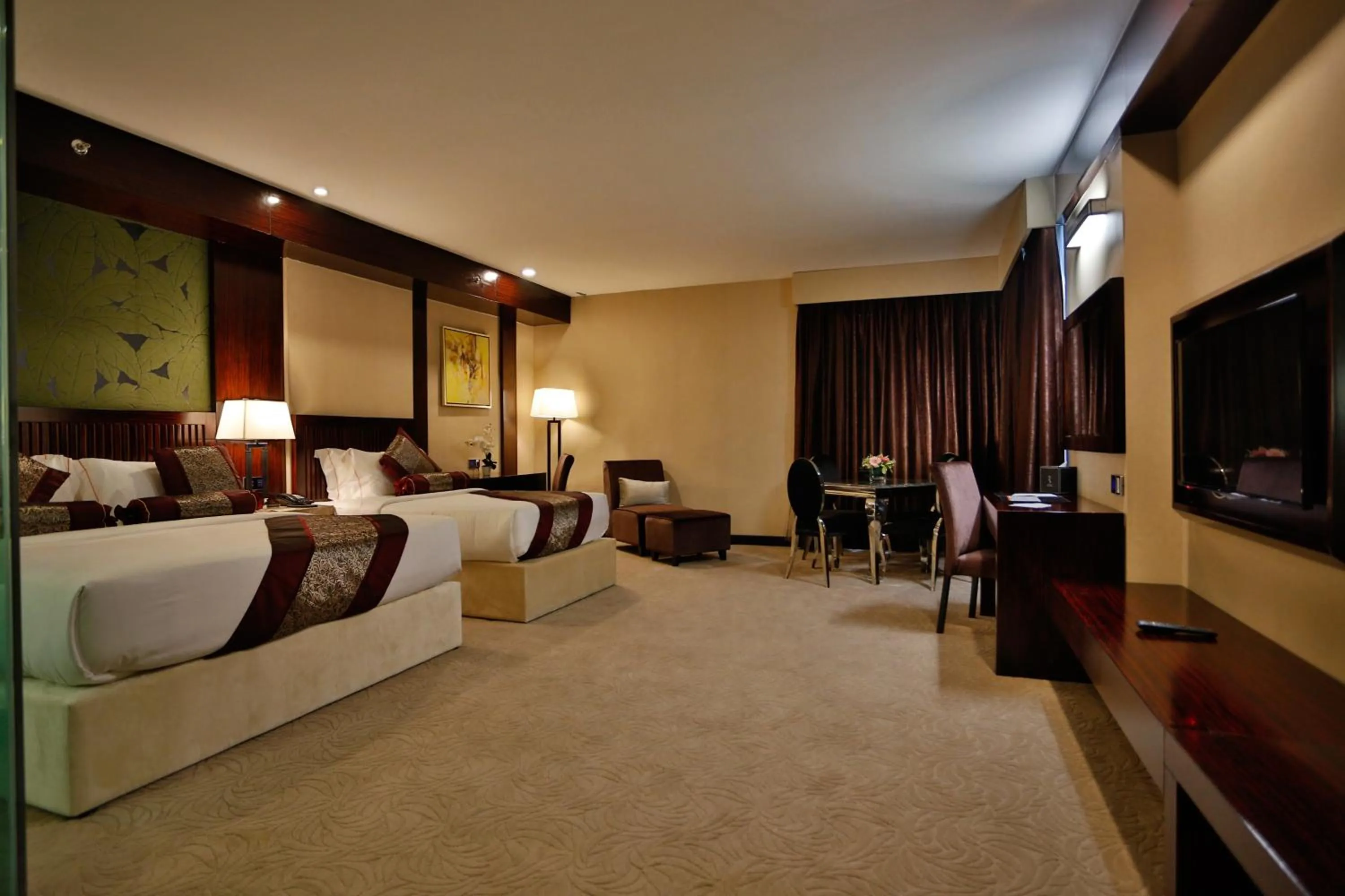 Bed in Royale Signature Hotel