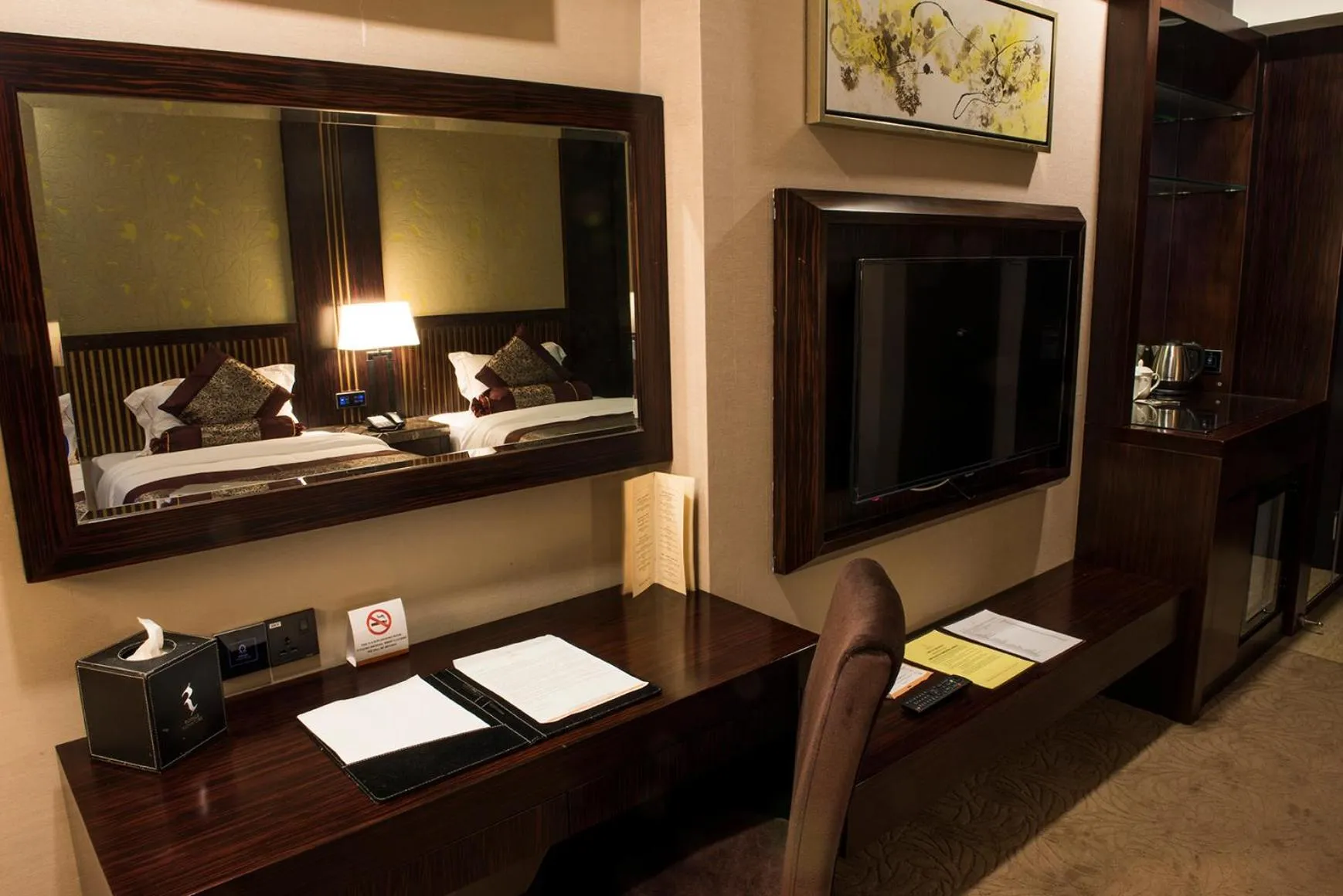 Bed in Royale Signature Hotel