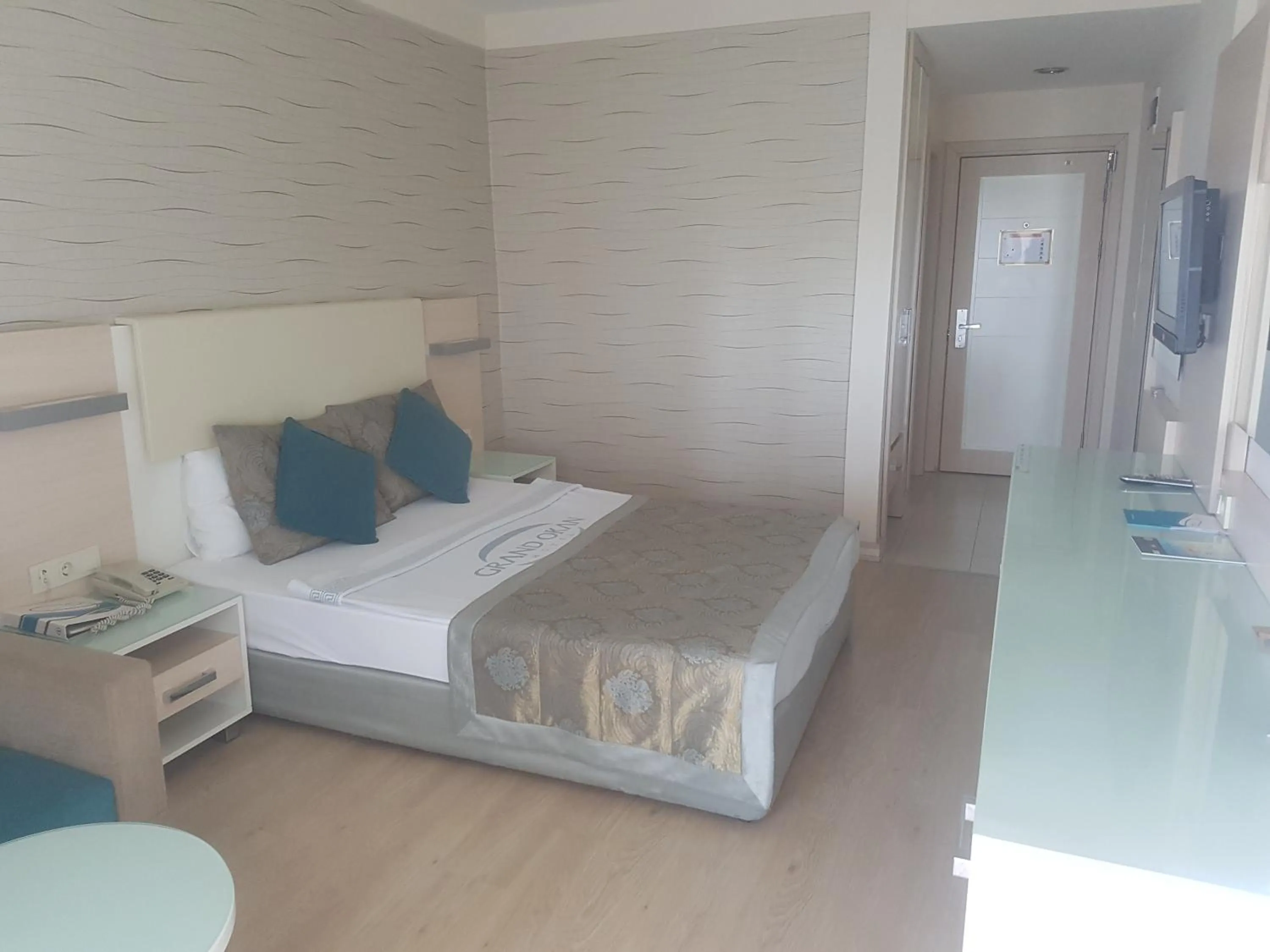 Photo of the whole room, Bed in Grand Okan Hotel