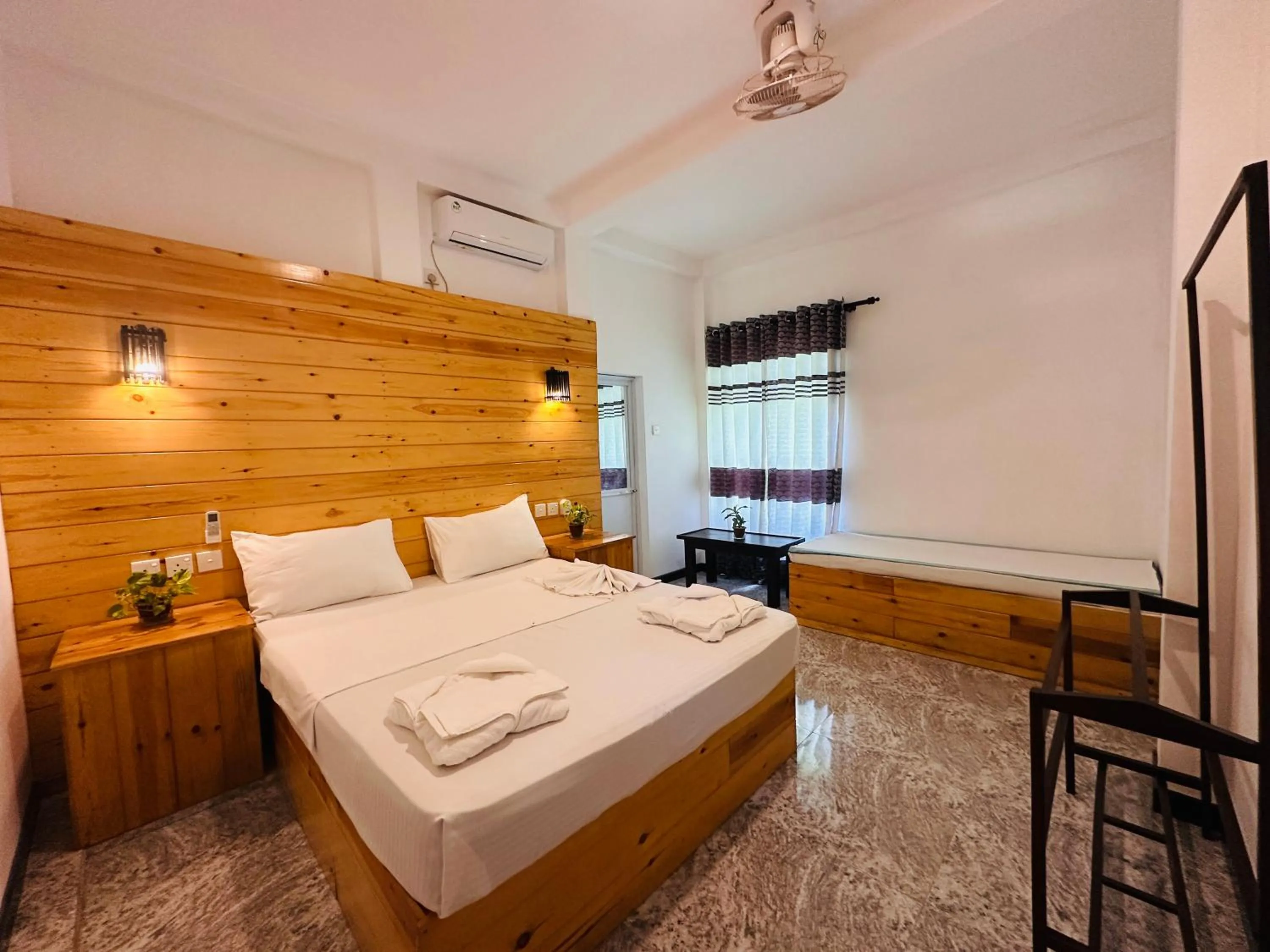 Bed in Rekawa Turtle Gate Hotel