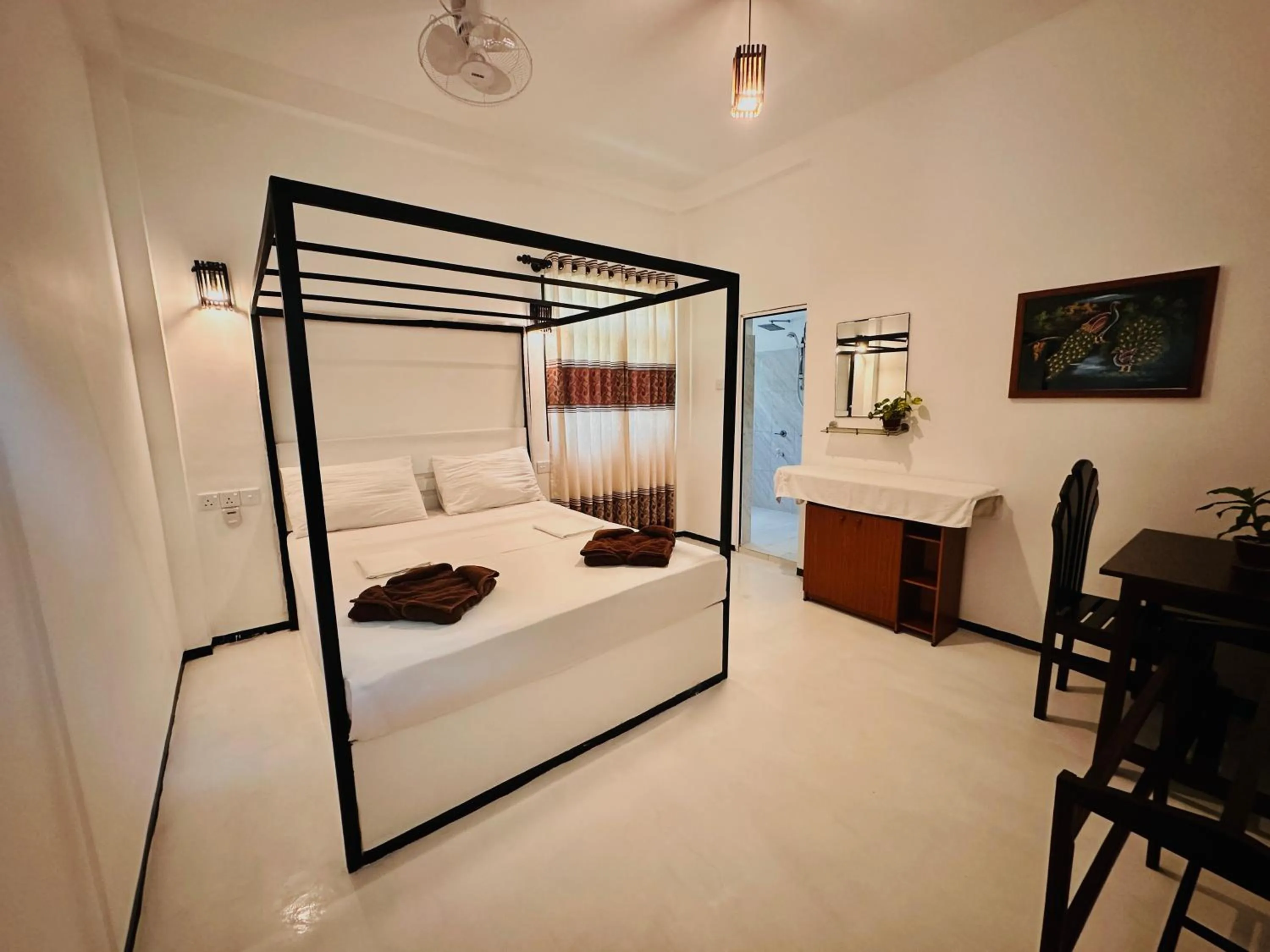 Bed in Rekawa Turtle Gate Hotel