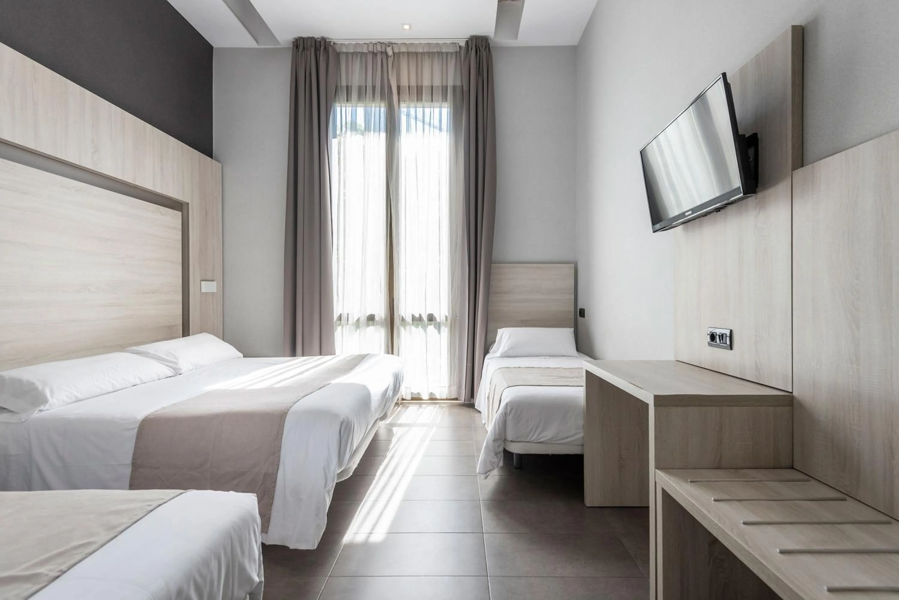 Bed in Plaza Goya Rooms