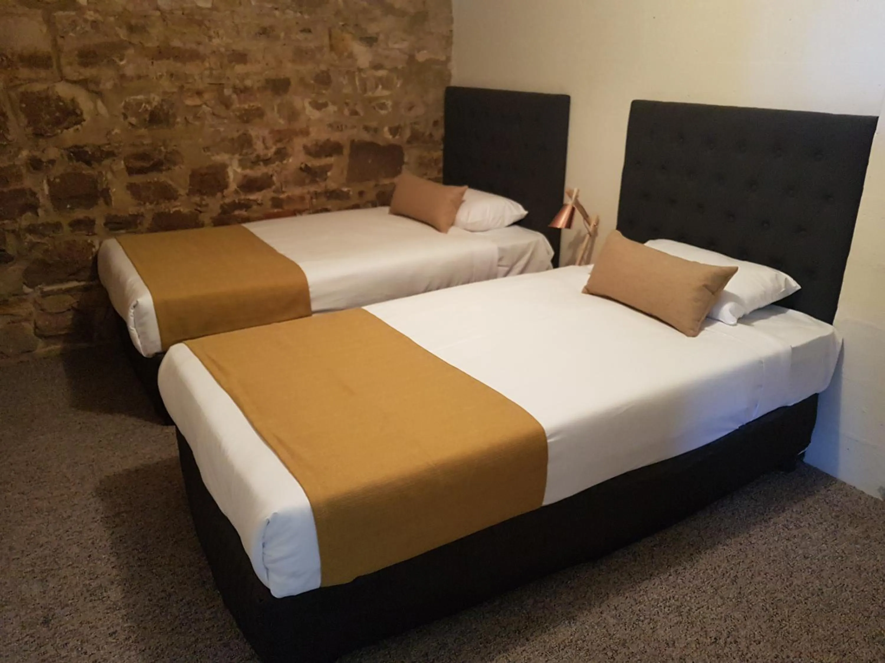 Bed in The Richmond Arms Hotel