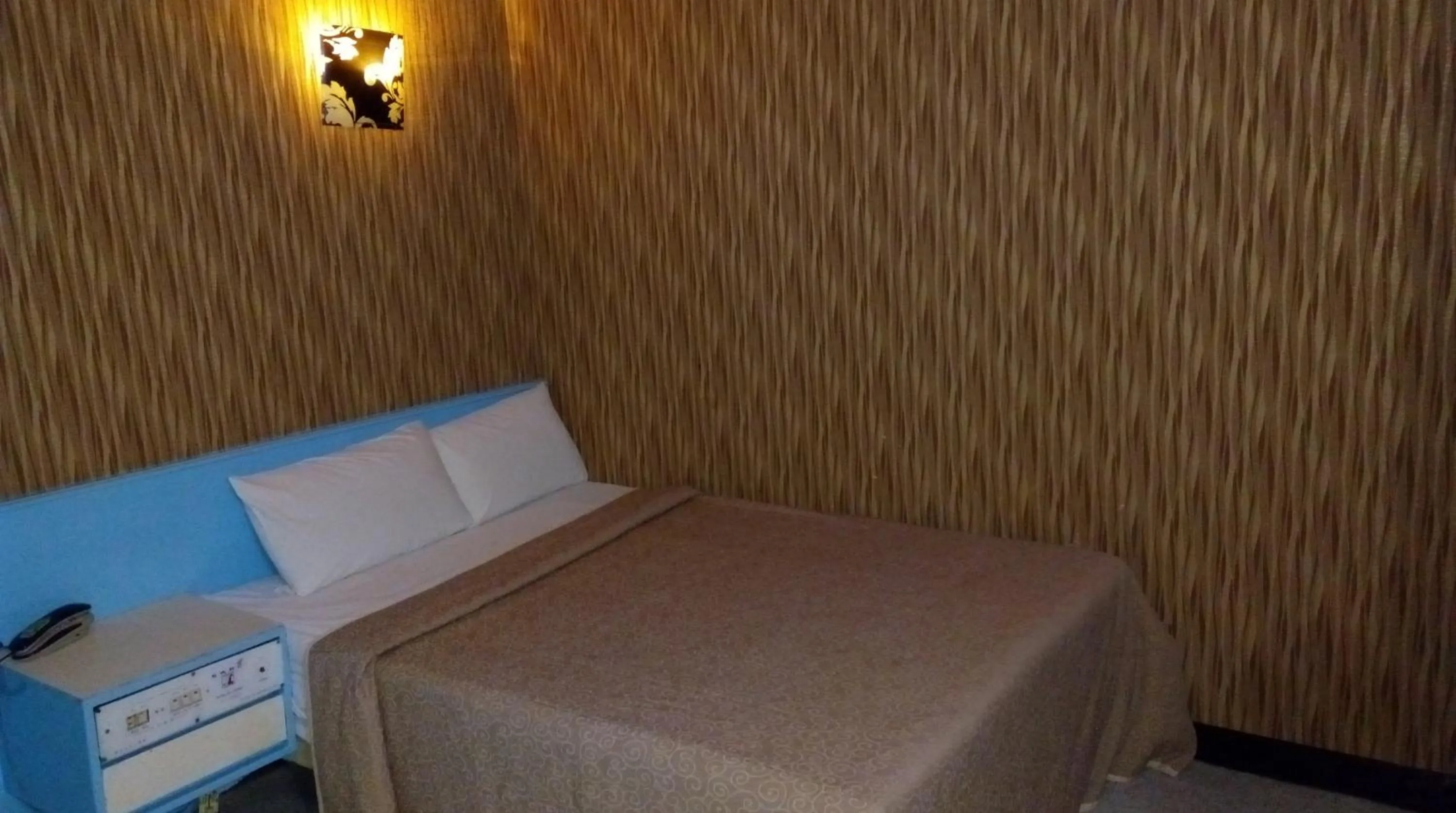 Bed in Reui Chung Hotel