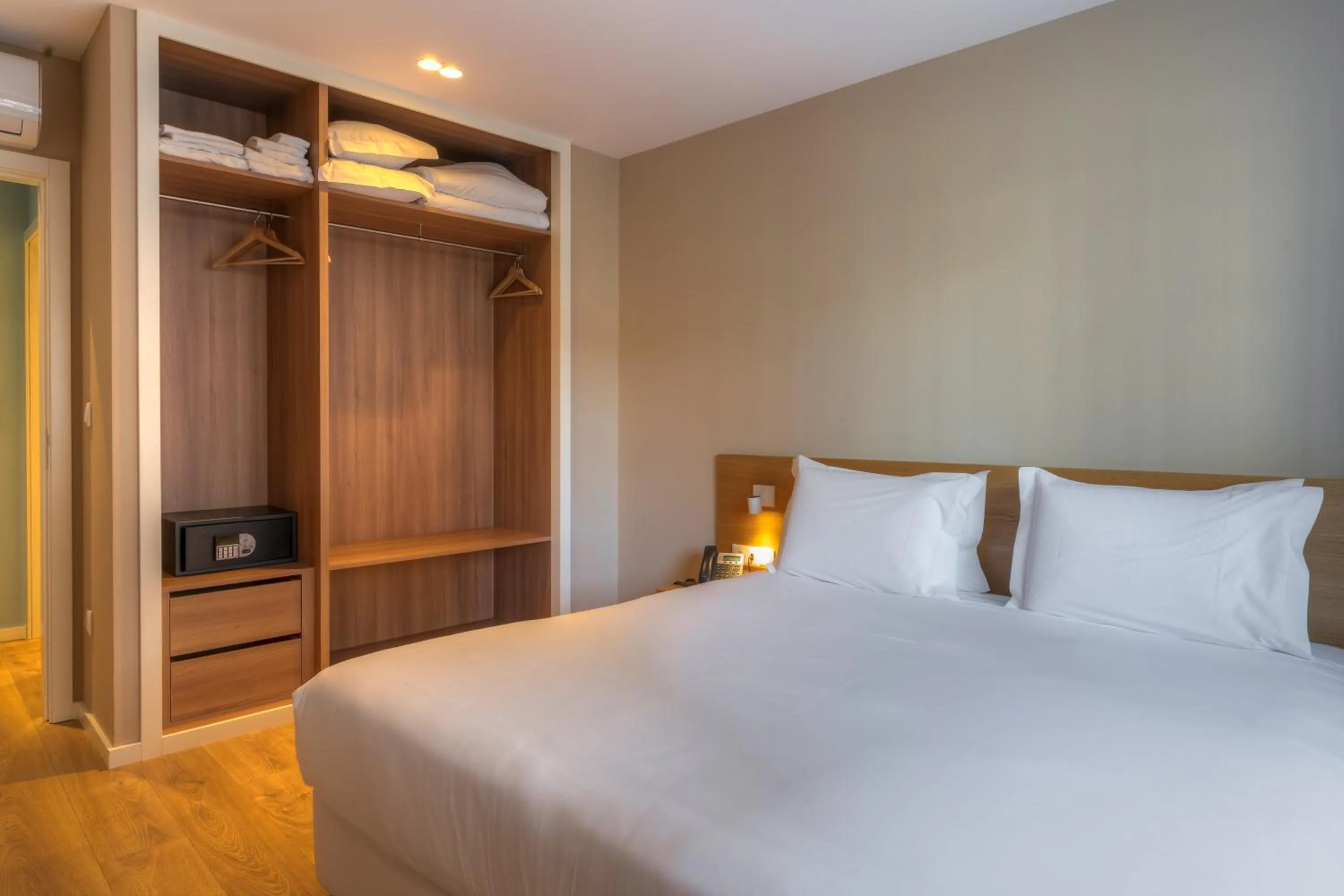 Bed in Spot Family Apartments