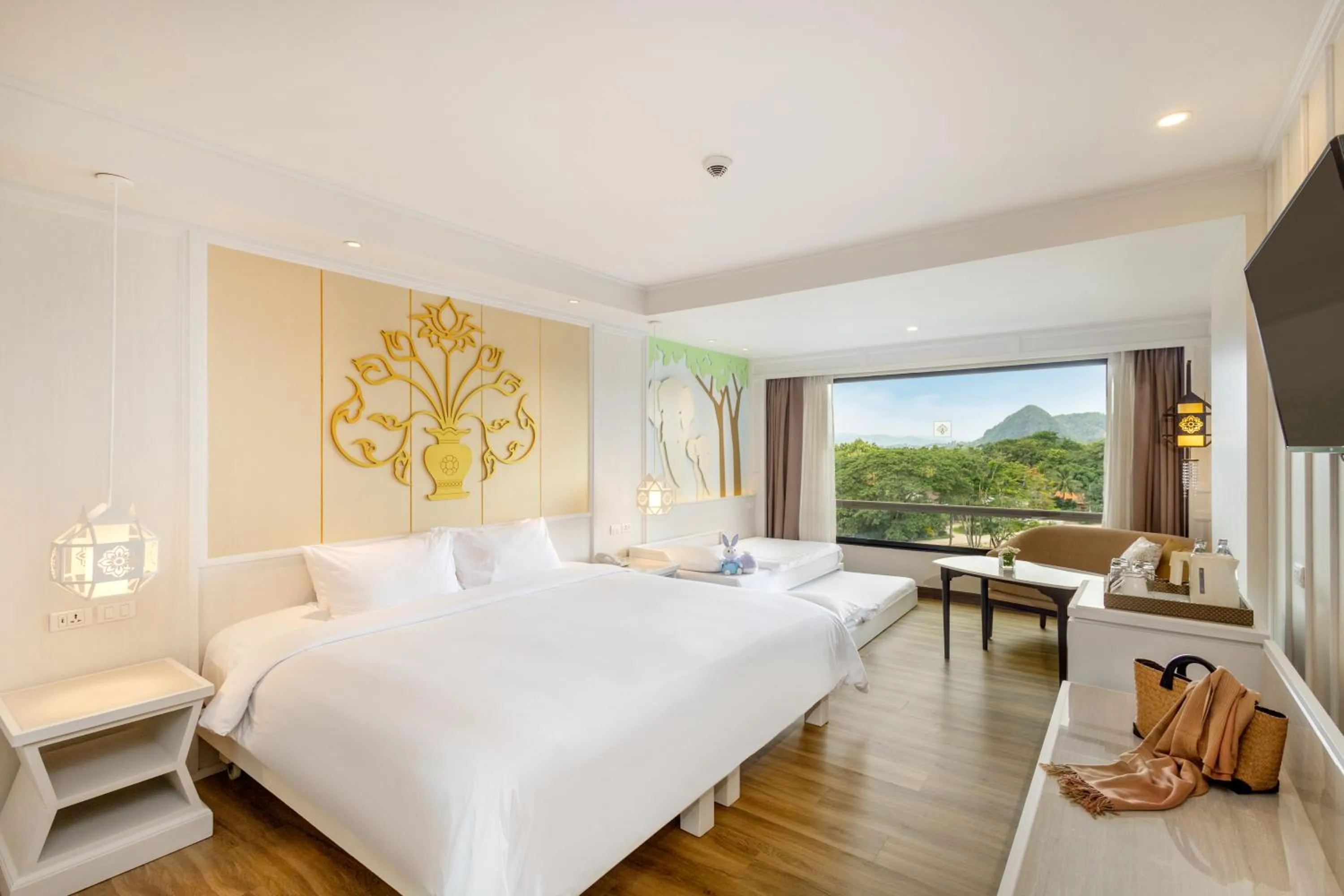 Seating area, Bed in The Riverie by Katathani