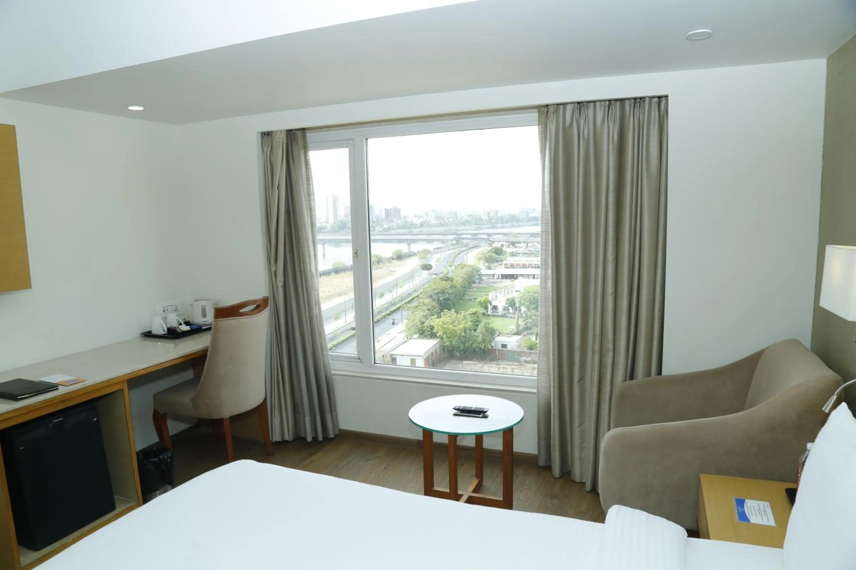 View (from property/room), Bed in Sarovar Portico Rivera Ahmedabad