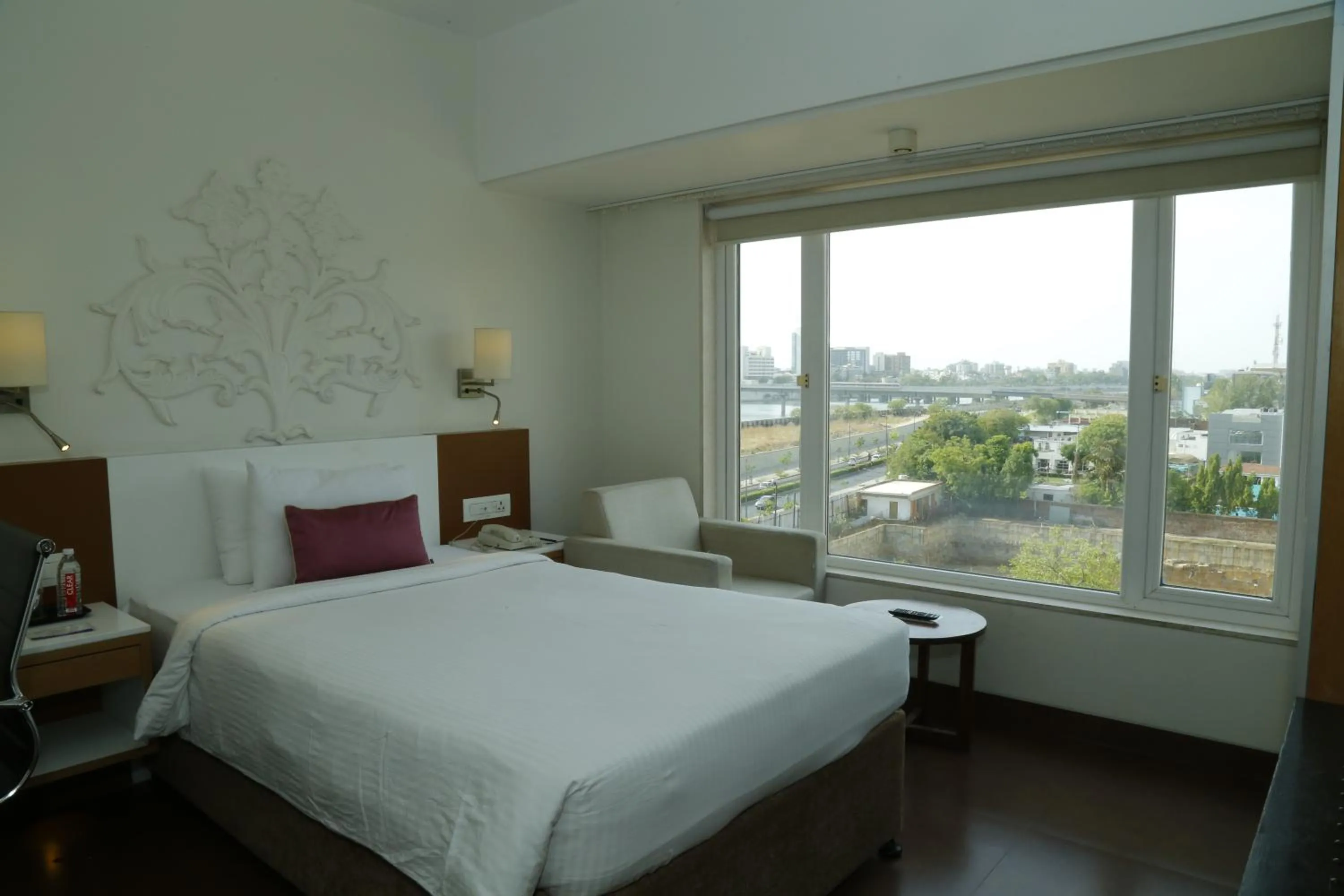 Bed in Sarovar Portico Rivera Ahmedabad