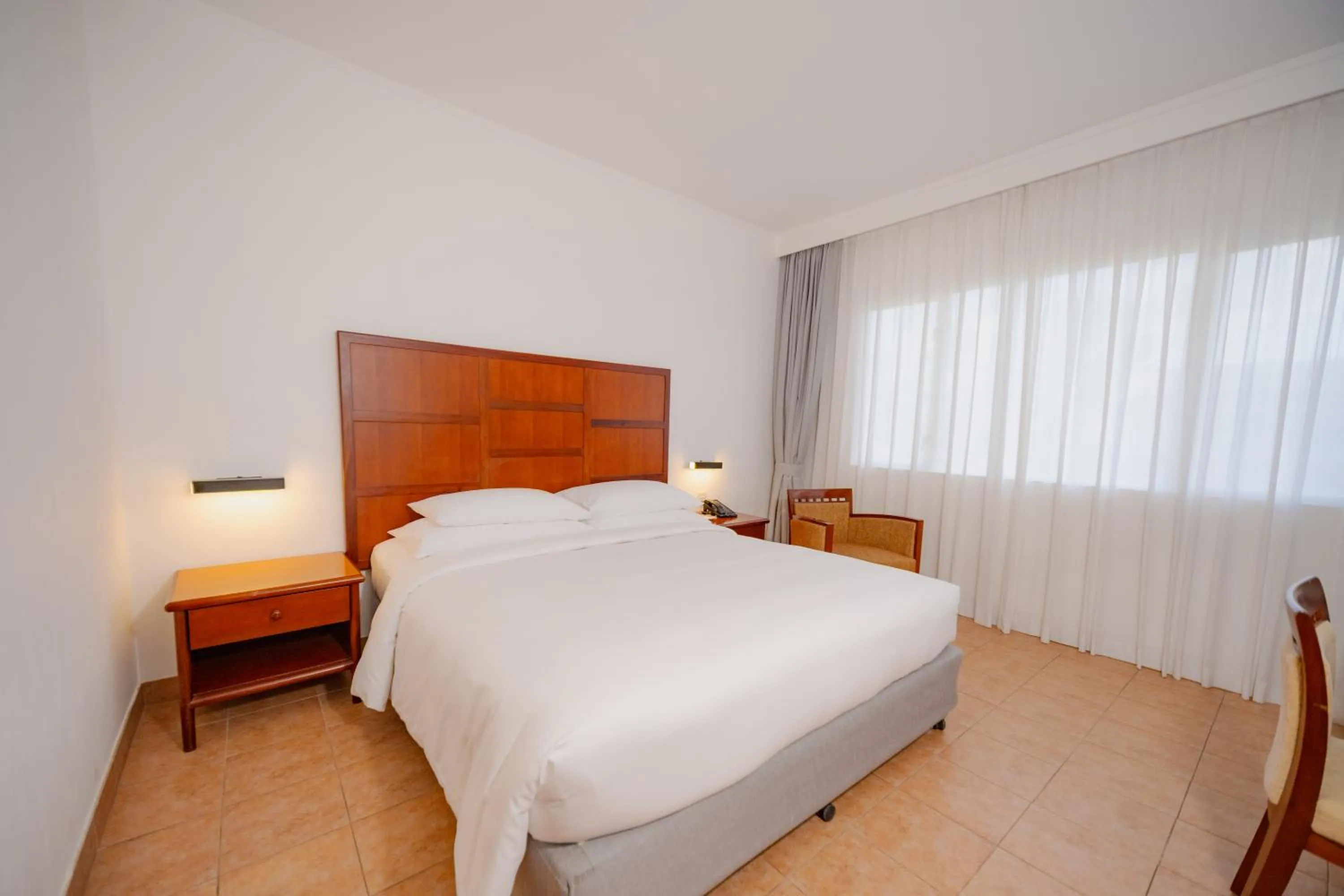 Photo of the whole room, Bed in Hulhule Island Hotel- Private Beach Access & Airport Pick-up and Drop