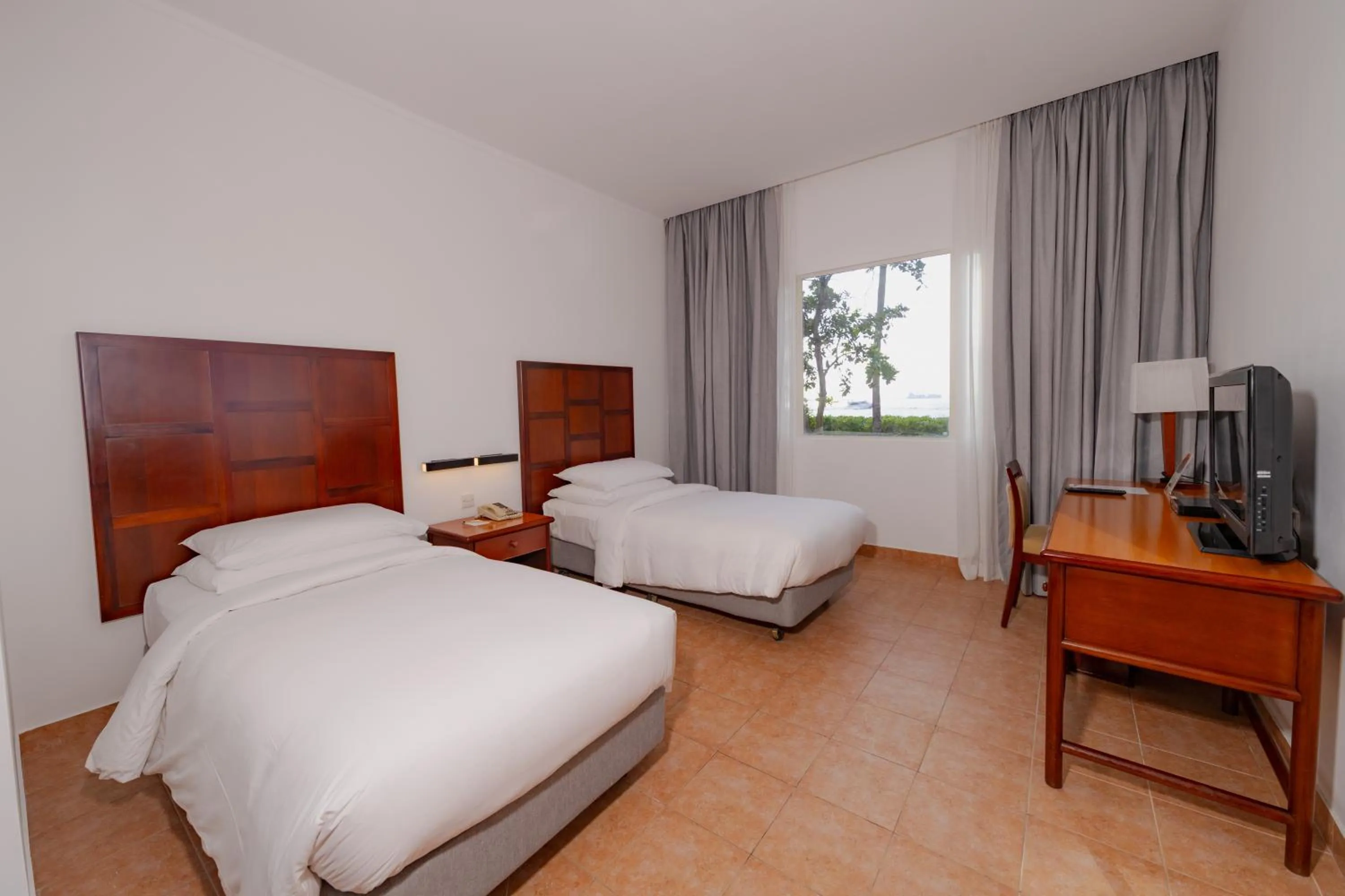 Photo of the whole room, Bed in Hulhule Island Hotel- Private Beach Access & Airport Pick-up and Drop