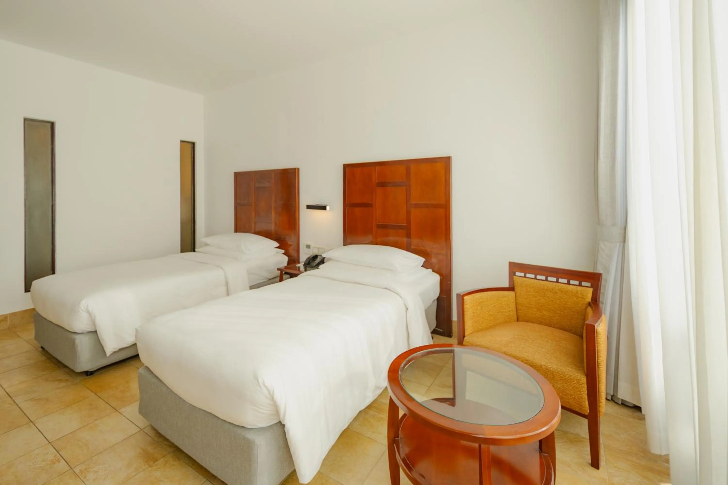 Photo of the whole room, Bed in Hulhule Island Hotel- Private Beach Access & Airport Pick-up and Drop