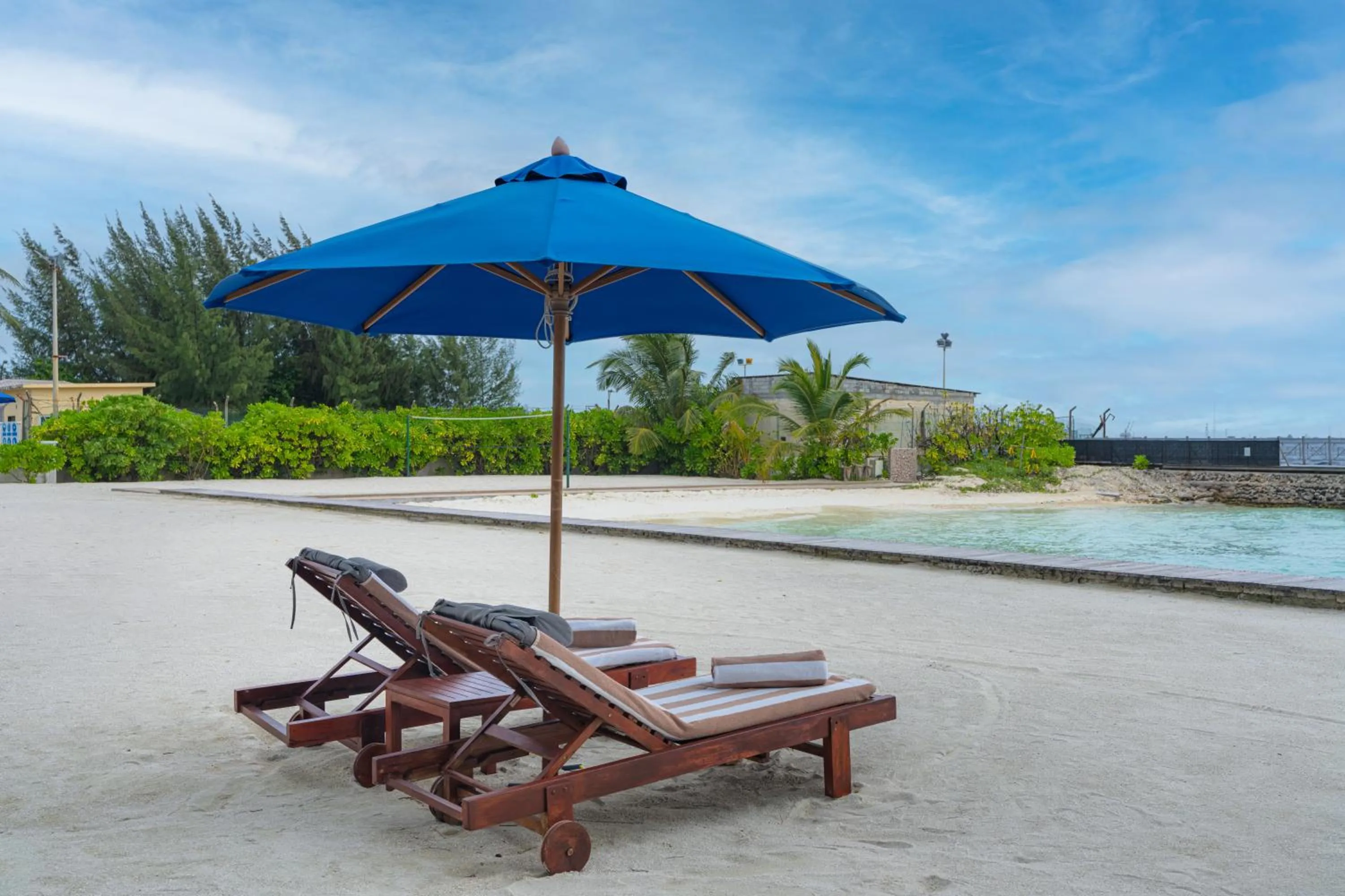 Property building in Hulhule Island Hotel- Private Beach Access & Airport Pick-up and Drop