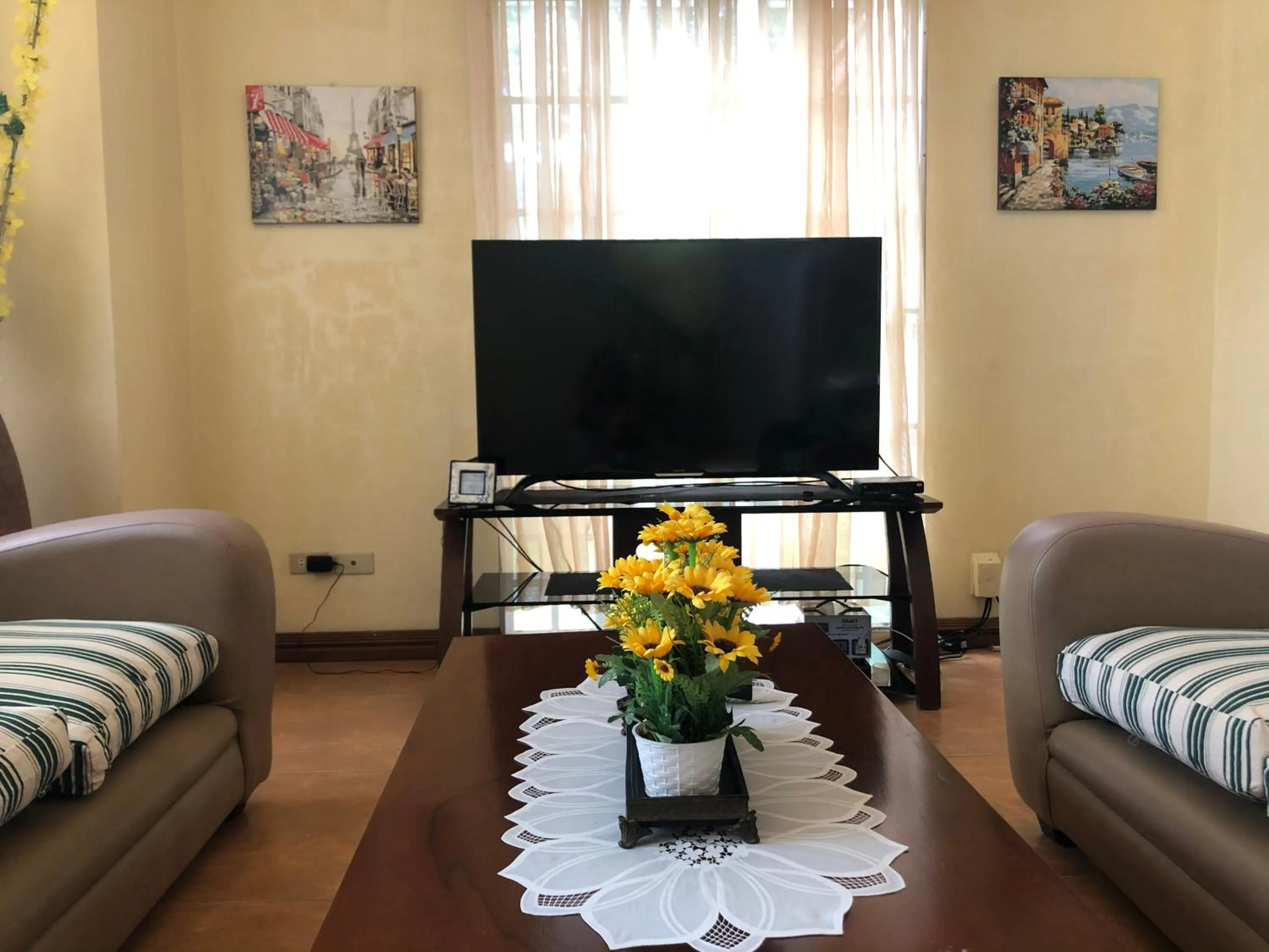 Communal lounge/ TV room in Charming Tagaytay Vacation Home