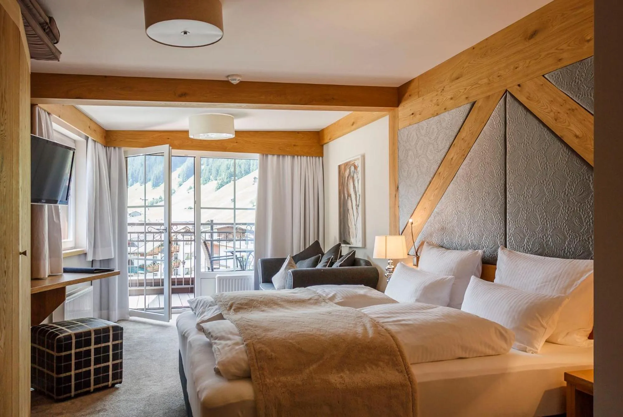 Photo of the whole room, Bed in Hotel Tirolerhof 4 Sterne Superior