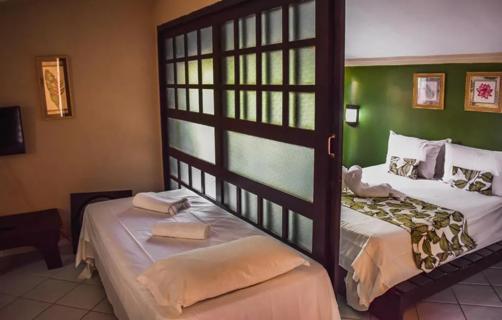 Bed in Pousada Recanto da Coruja