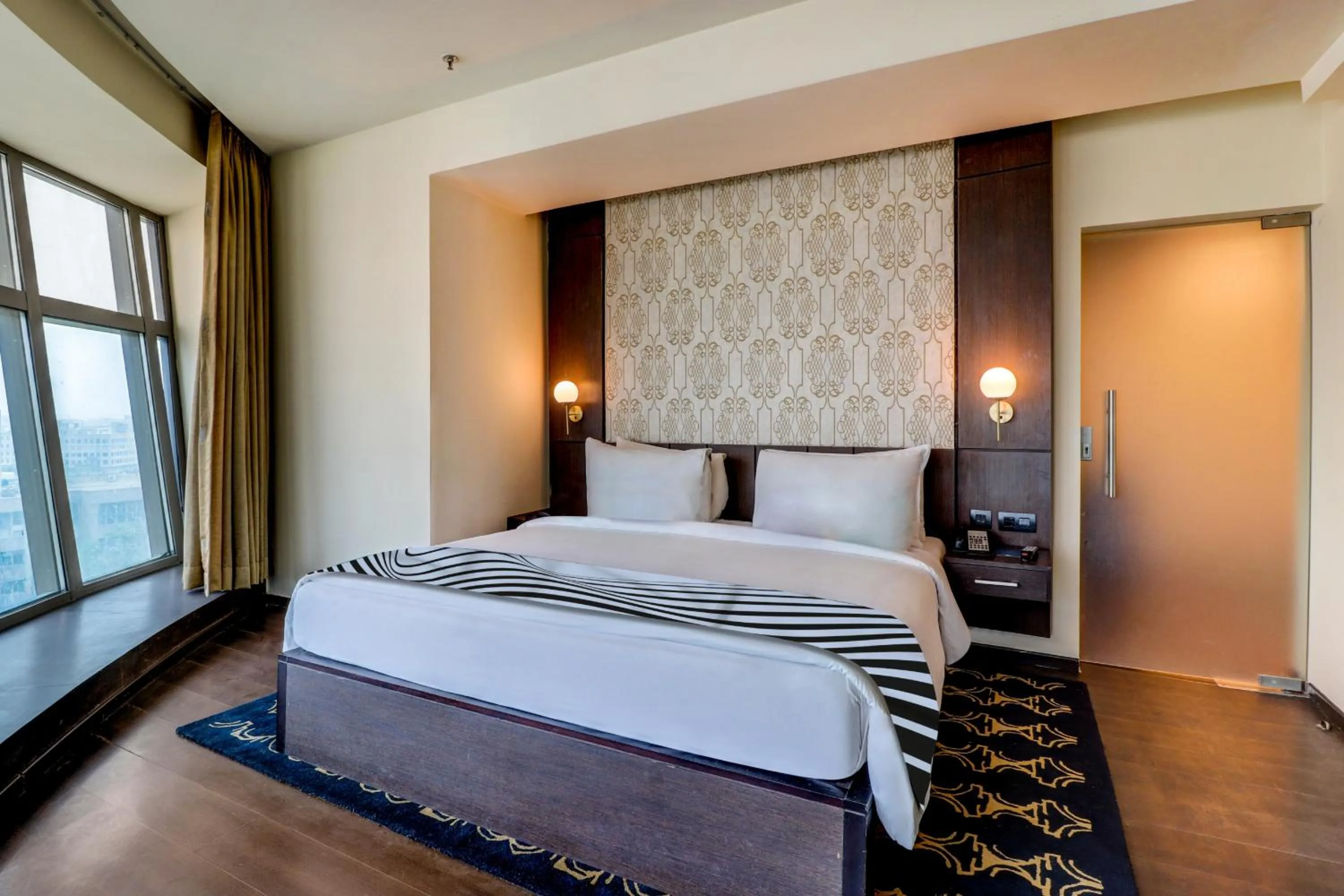 Bed in Sunday Hotel by CheckIn Jaipur