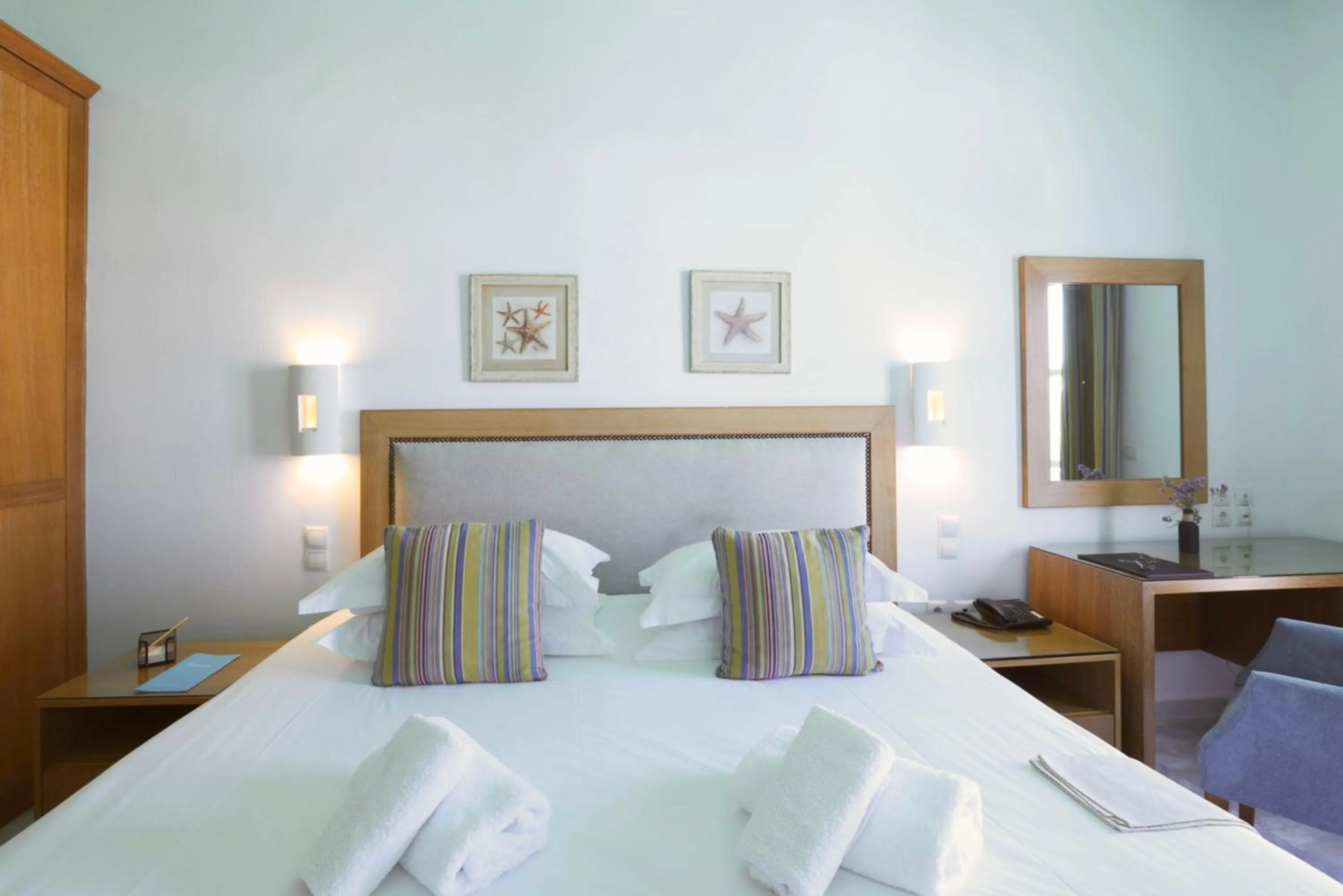 Bed in Poseidon Hotel Suites