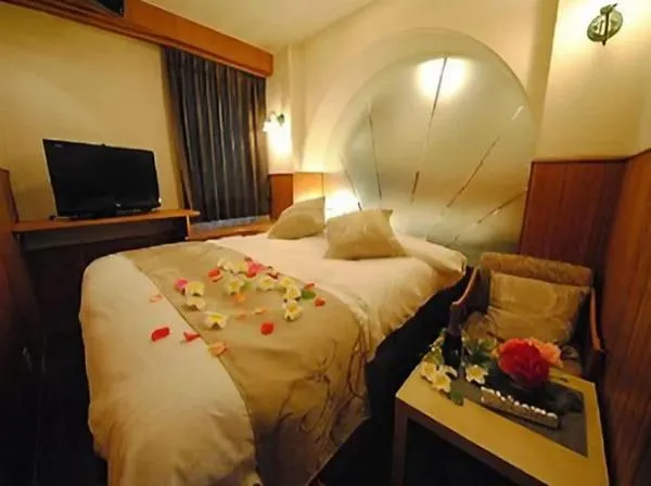 Bed in ホテル マリオン 鈴鹿