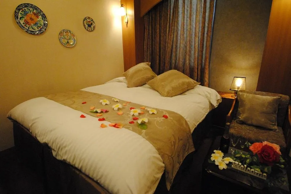 Bed in ホテル マリオン 鈴鹿