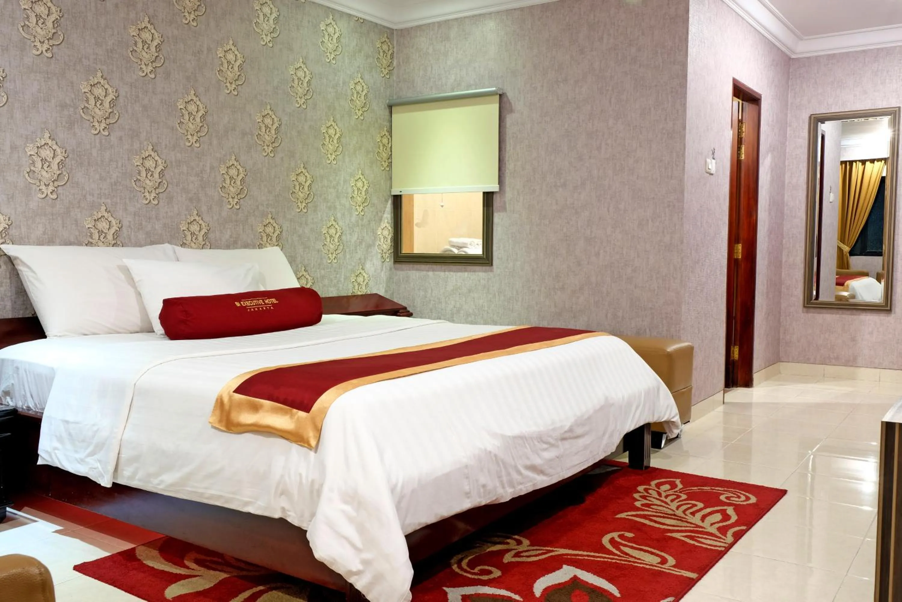 Bed in BI Executive Hotel