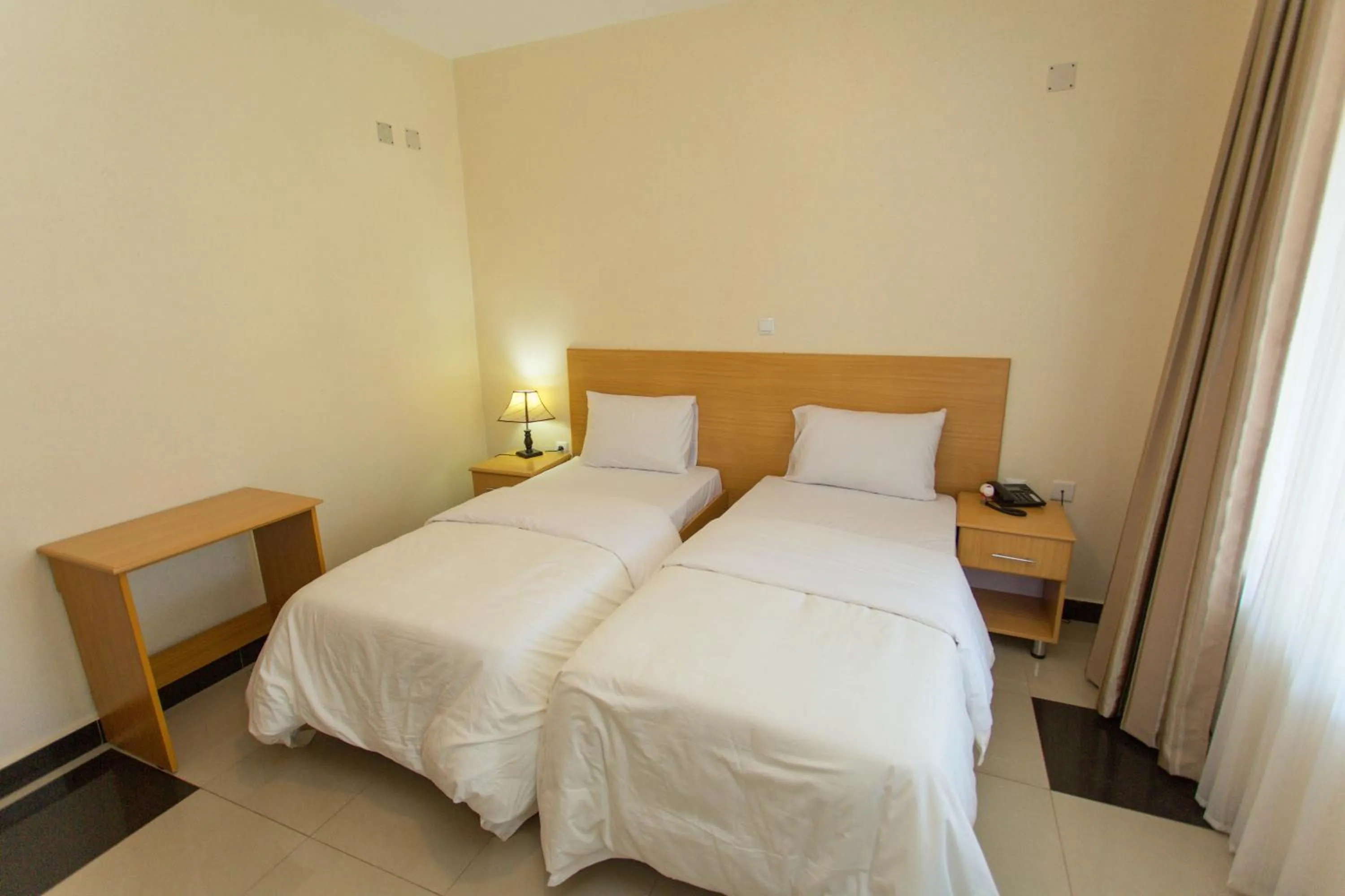 Bed in Anthurium Residential Hotel