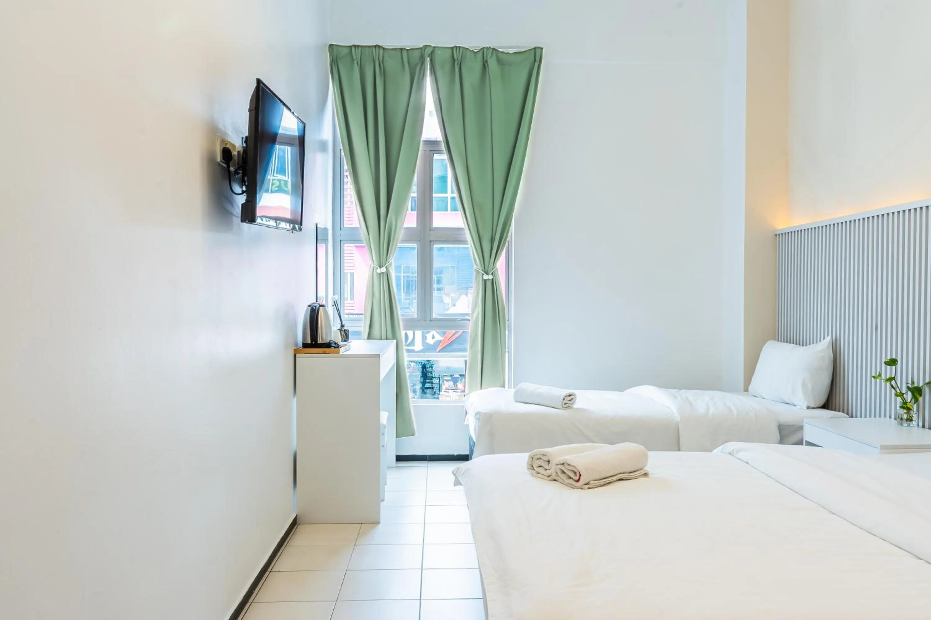 Bed in Ihome Boutique Hotel