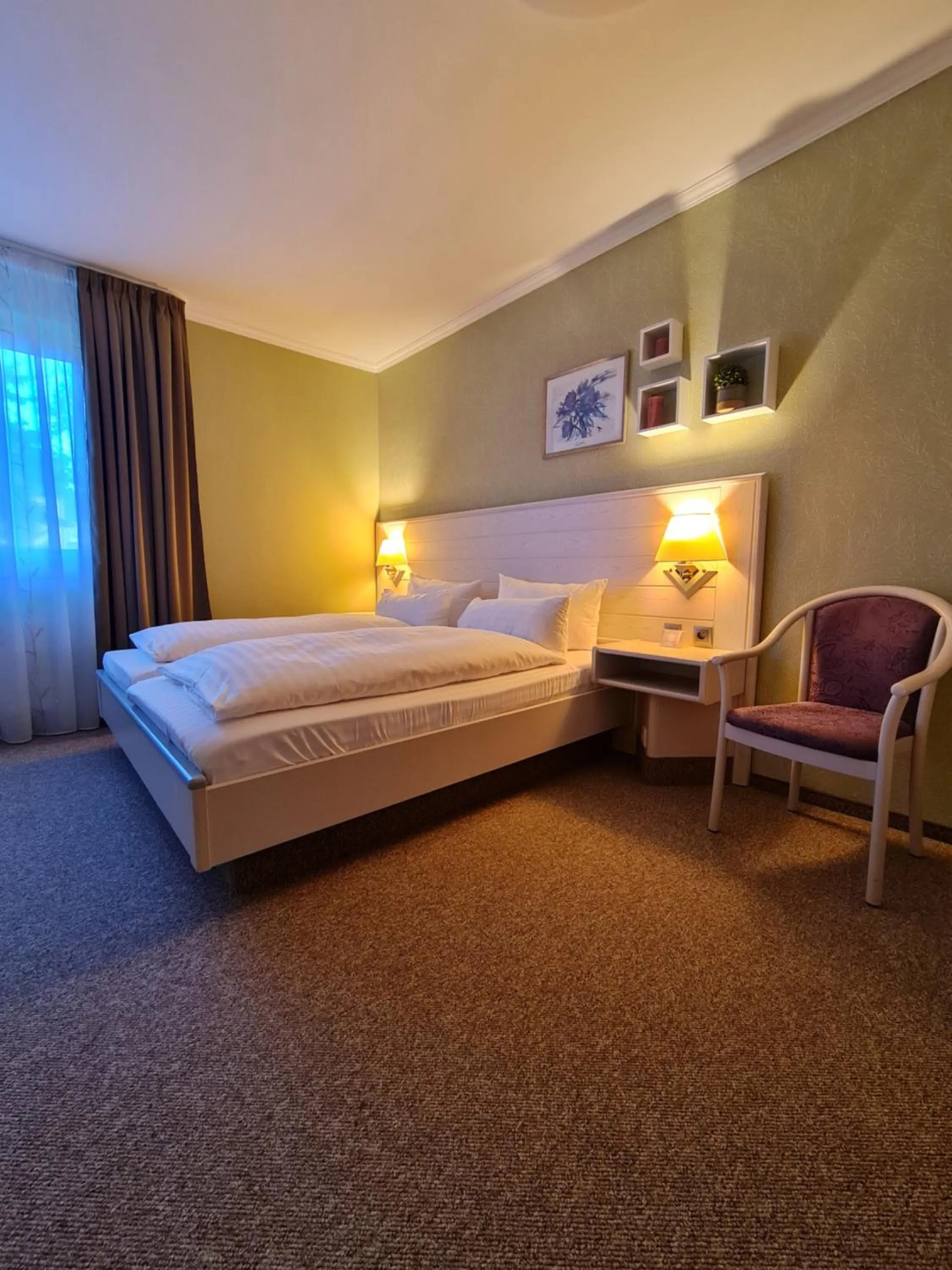Bed in Ambiente Hotel garni
