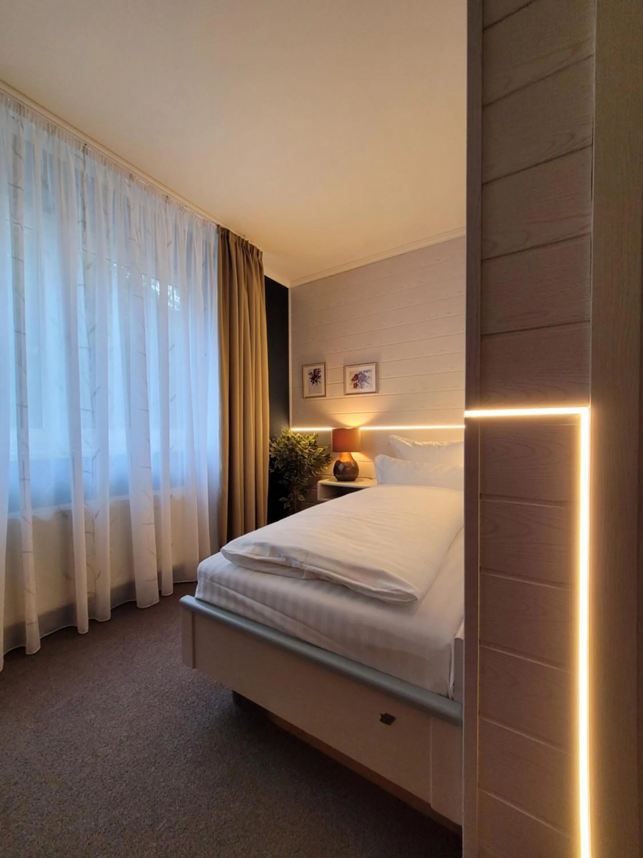 Bed in Ambiente Hotel garni