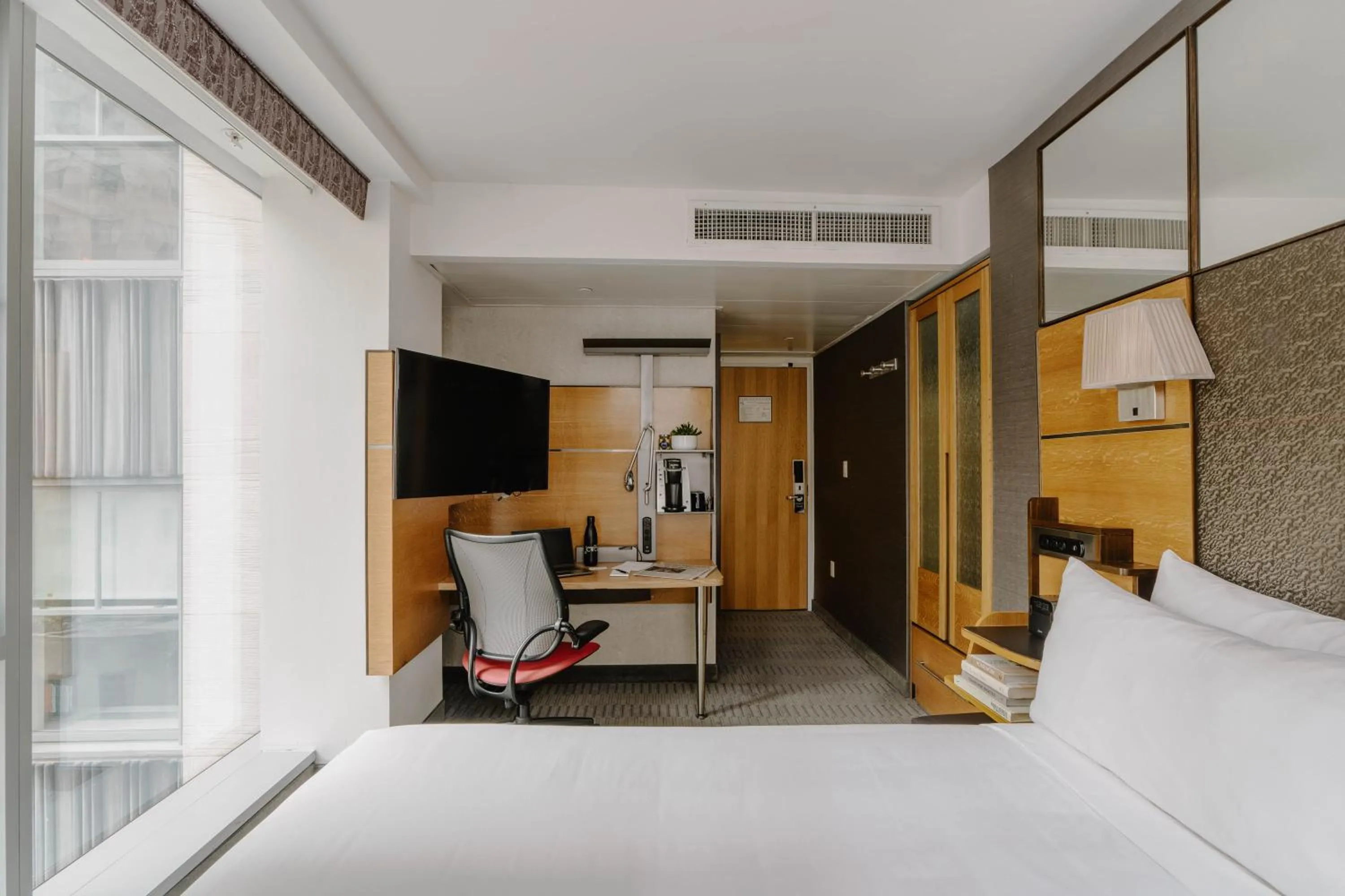 Bed in The Jewel Hotel, New York