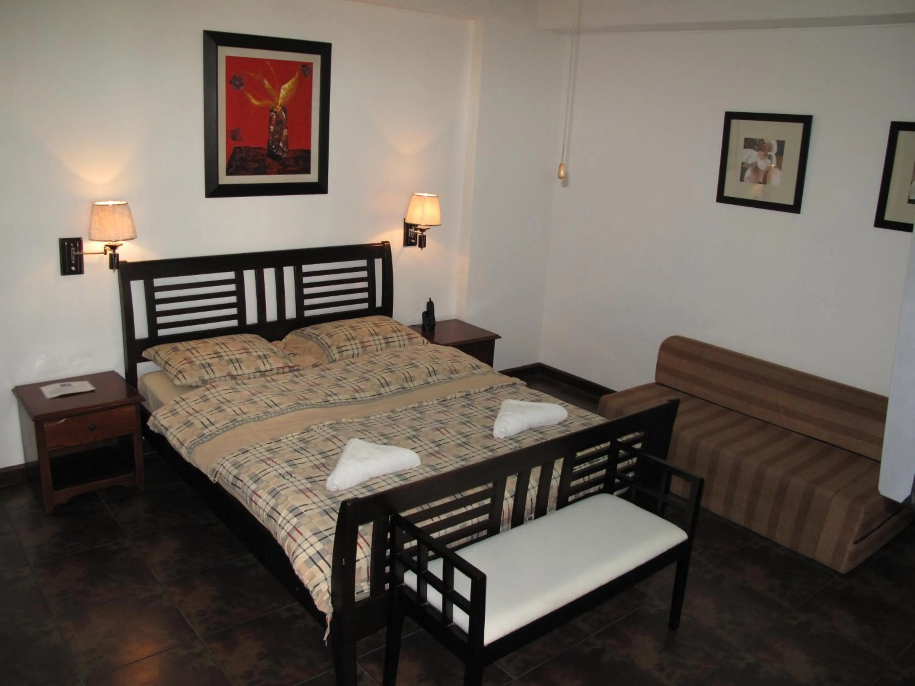 Bed in Makati Suites at Travelers Inn